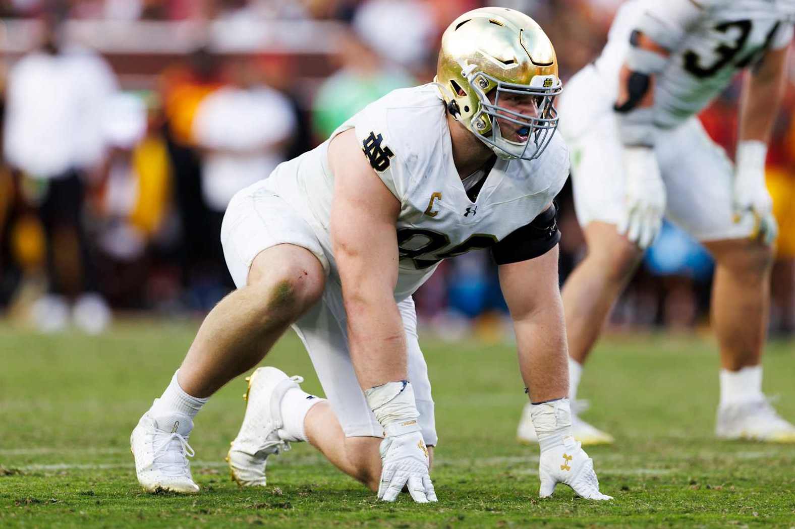 LOS ANGELES, CALIFORNIA - NOVEMBER 30: Rylie Mills #99 of the Notre Dame Fighting Irish in a defensive stance during the second half against USC Trojans at United Airlines Field at the Los Angeles Memorial Coliseum on November 30, 2024 in Los Angeles, California. (Photo by Ric Tapia/Getty Images)
