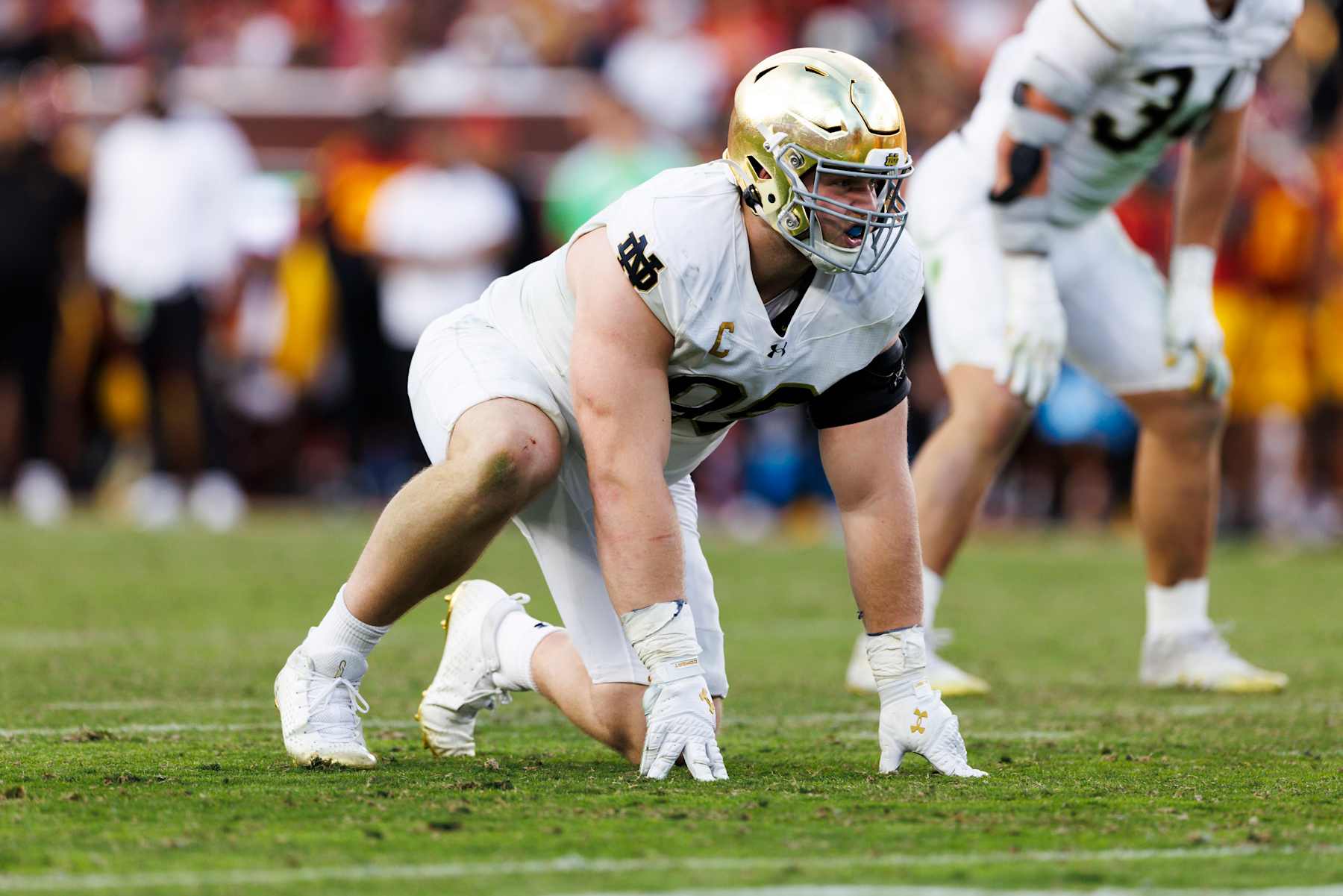 LOS ANGELES, CALIFORNIA - NOVEMBER 30: Rylie Mills #99 of the Notre Dame Fighting Irish in a defensive stance during the second half against USC Trojans at United Airlines Field at the Los Angeles Memorial Coliseum on November 30, 2024 in Los Angeles, California. (Photo by Ric Tapia/Getty Images)