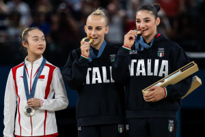 Olympic Fans Love Chinese Gymnast Zhou Yaqin's Wholesome Viral Video on Podium
