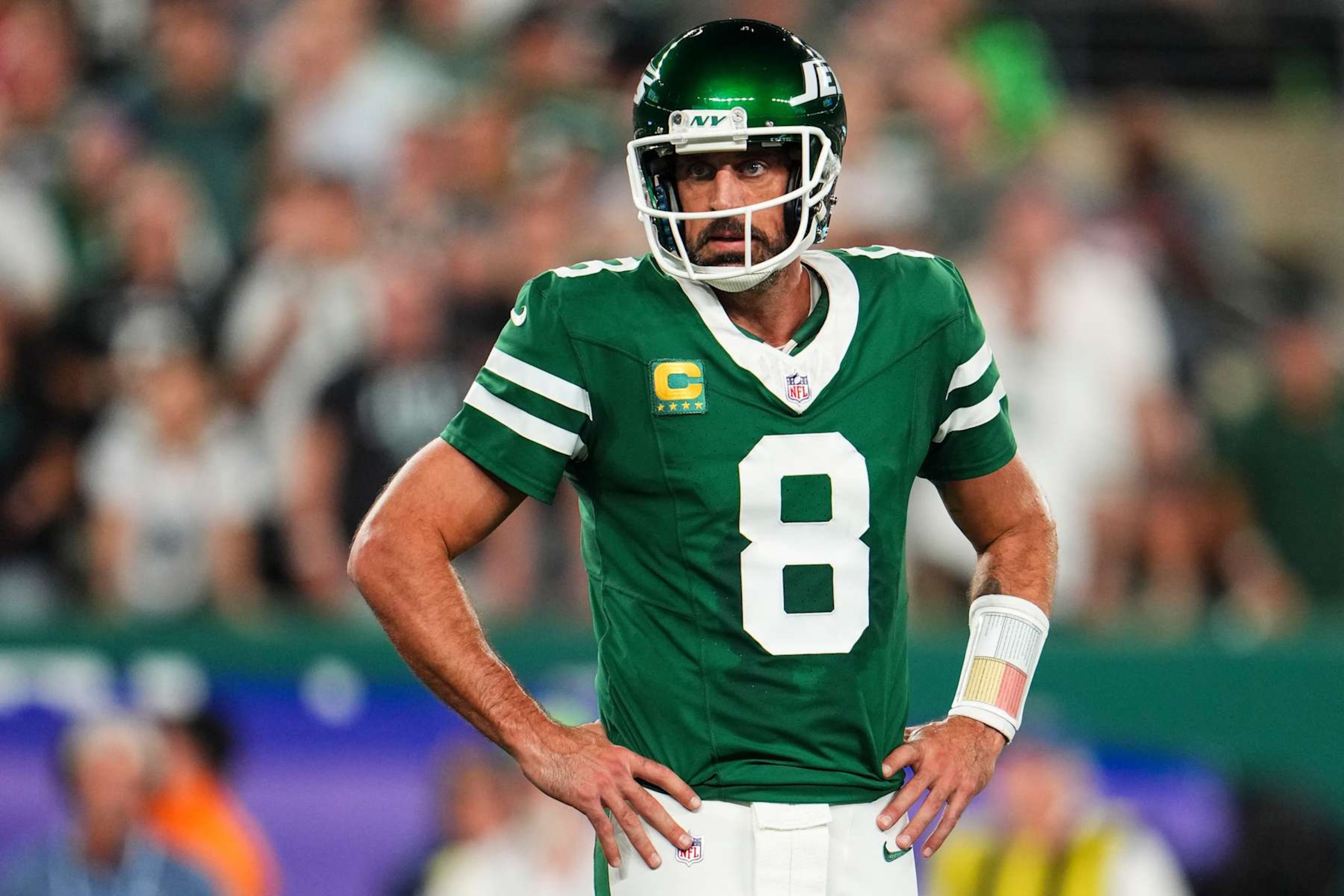 EAST RUTHERFORD, NJ - SEPTEMBER 19: Aaron Rodgers #8 of the New York Jets reacts during an NFL football game against the New England Patriots at MetLife Stadium on September 19, 2024 in East Rutherford, New Jersey. (Photo by Cooper Neill/Getty Images)