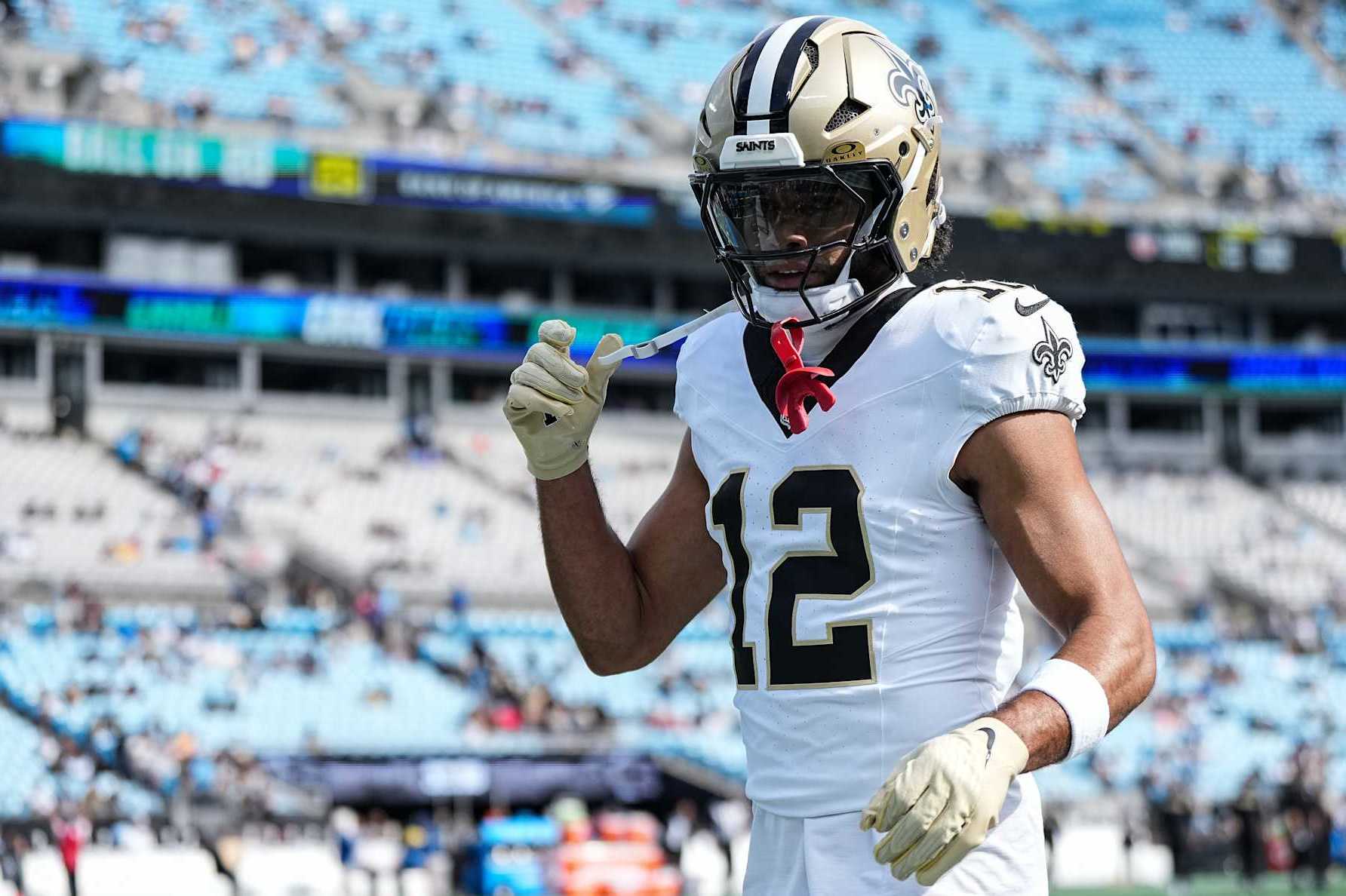 CHARLOTTE, NORTH CAROLINA - NOVEMBER 03: Chris Olave #12 of the New Orleans Saints looks on prior to his game against the Carolina Panthers at Bank of America Stadium on November 03, 2024 in Charlotte, North Carolina. (Photo by Matt Kelley/Getty Images)