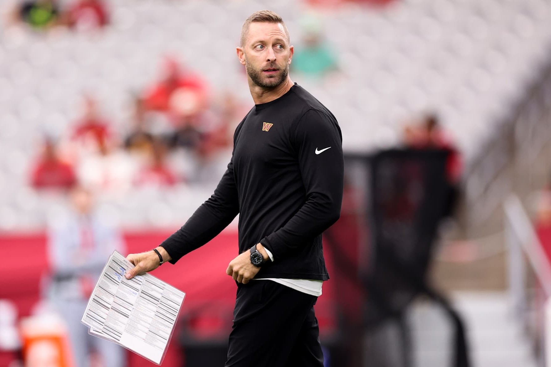 GLENDALE, ARIZONA - SEPTEMBER 29: Offensive Coordinator Kliff Kingsbury of the Washington Commanders looks on prior to a game against the Arizona Cardinals at State Farm Stadium on September 29, 2024 in Glendale, Arizona. (Photo by Christian Petersen/Getty Images)