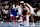 MINNEAPOLIS, MINNESOTA - NOVEMBER 28: Shai Gilgeous-Alexander #2 of the Oklahoma City Thunder dribbles the ball while Anthony Edwards #5 of the Minnesota Timberwolves defends in the first quarter during an NBA In-Season Tournament game at Target Center on November 28, 2023 in Minneapolis, Minnesota. The Timberwolves defeated the Thunder 106-103. NOTE TO USER: User expressly acknowledges and agrees that, by downloading and or using this photograph, User is consenting to the terms and conditions of the Getty Images License Agreement. (Photo by David Berding/Getty Images)