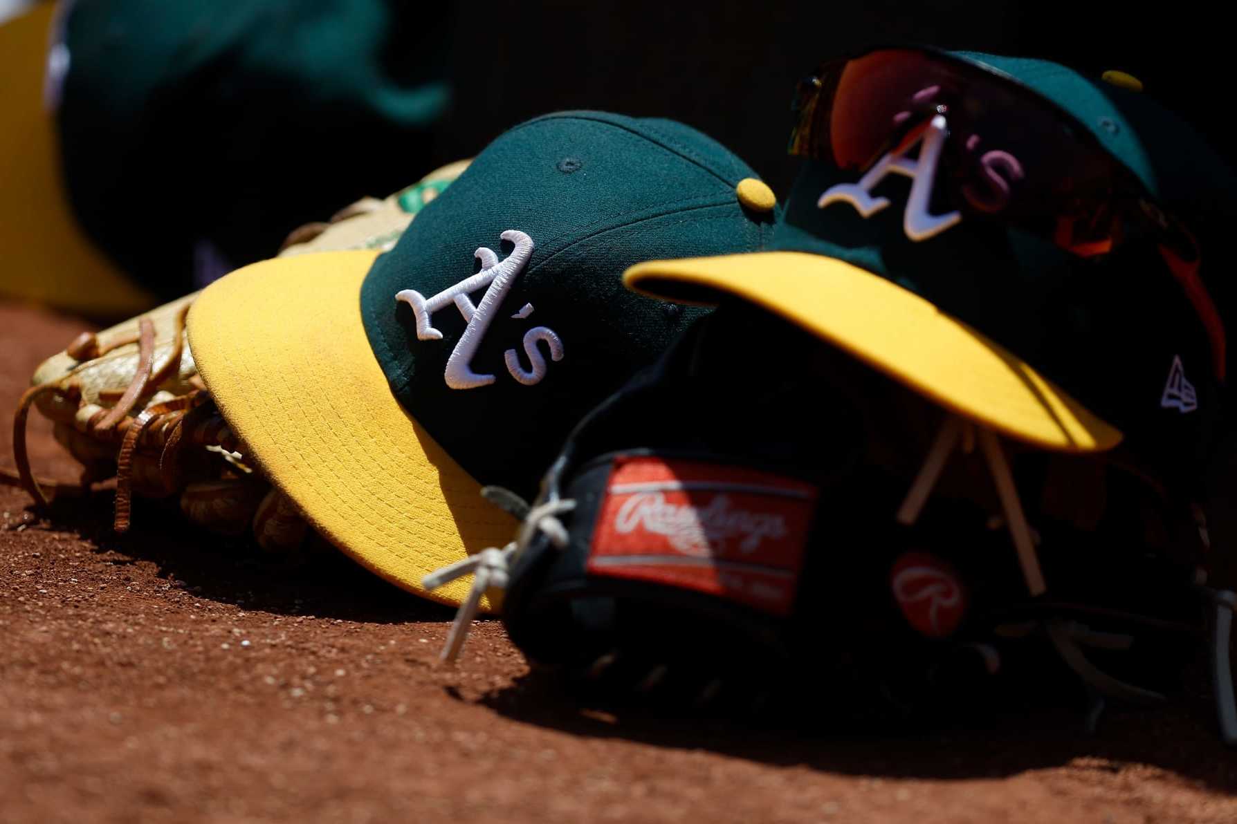 OAKLAND, CALIFORNIA - MAY 31: A detail shot of Oakland Athletics hats sitting in the dugout during the game against the Atlanta Braves at RingCentral Coliseum on May 31, 2023 in Oakland, California. (Photo by Lachlan Cunningham/Getty Images)