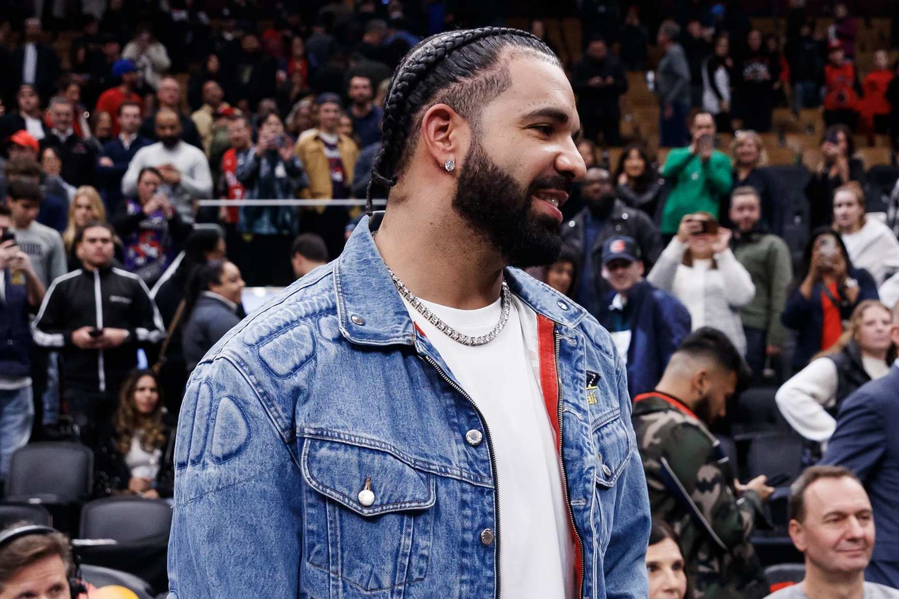 TORONTO, CANADA - NOVEMBER 17: Rapper Drake greets Jayson Tatum #0 of the Boston Celtics after their NBA In-Season Tournament game against the Toronto Raptors at Scotiabank Arena on November 17, 2023 in Toronto, Canada. NOTE TO USER: User expressly acknowledges and agrees that, by downloading and or using this photograph, User is consenting to the terms and conditions of the Getty Images License Agreement. (Photo by Cole Burston/Getty Images)