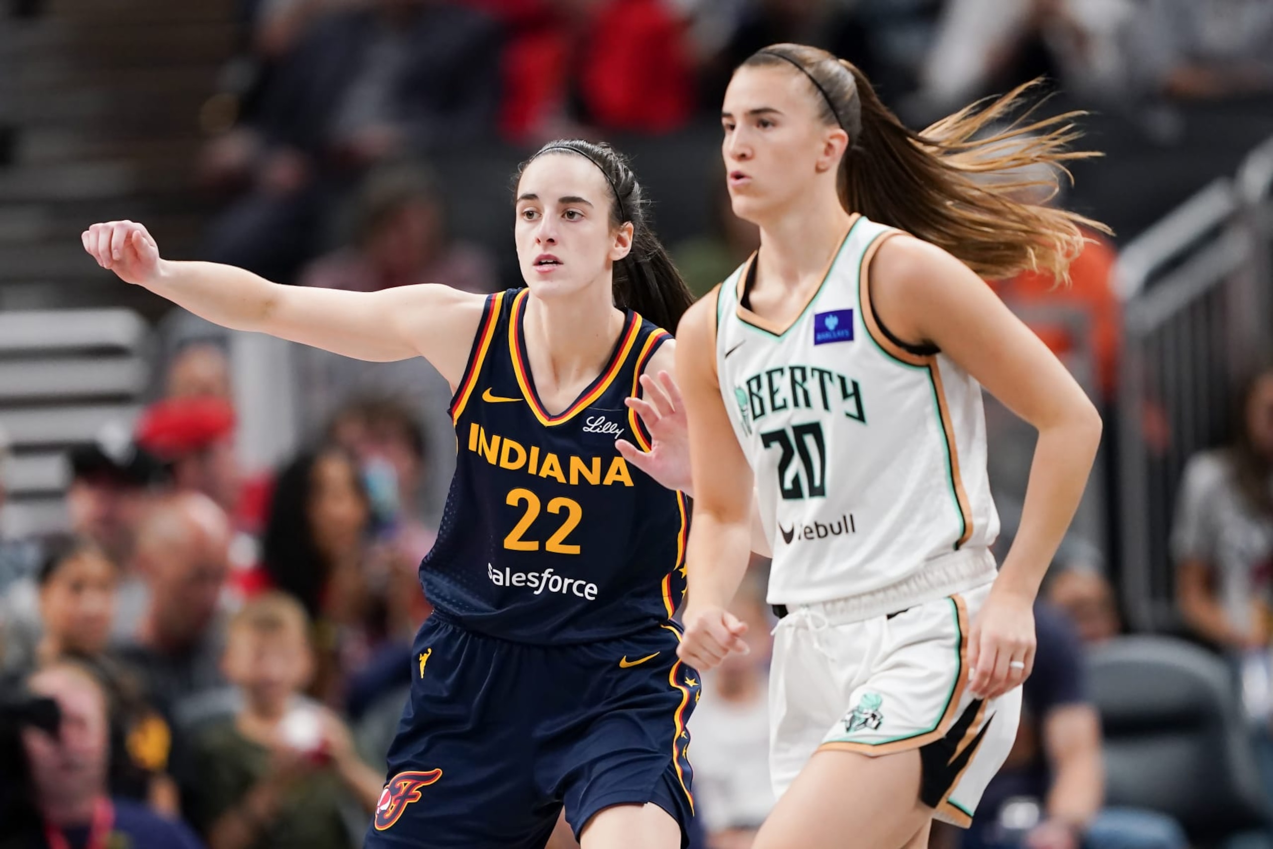 INDIANAPOLIS, INDIANA - MAY 16: Caitlin Clark #22 of the Indiana Fever guards against Sabrina Ionescu #20 of the New York Liberty in the third quarter at Gainbridge Fieldhouse on May 16, 2024 in Indianapolis, Indiana. NOTE TO USER: User expressly acknowledges and agrees that, by downloading and or using this photograph, User is consenting to the terms and conditions of the Getty Images License Agreement (Photo by Dylan Buell/Getty Images) INDIANAPOLIS, INDIANA - MAY 16: Caitlin Clark #22 of the Indiana Fever guards against Sabrina Ionescu #20 of the New York Liberty in the third quarter at Gainbridge Fieldhouse on May 16, 2024 in Indianapolis, Indiana. NOTE TO USER: User expressly acknowledges and agrees that, by downloading and or using this photograph, User is consenting to the terms and conditions of the Getty Images License Agreement (Photo by Dylan Buell/Getty Images)