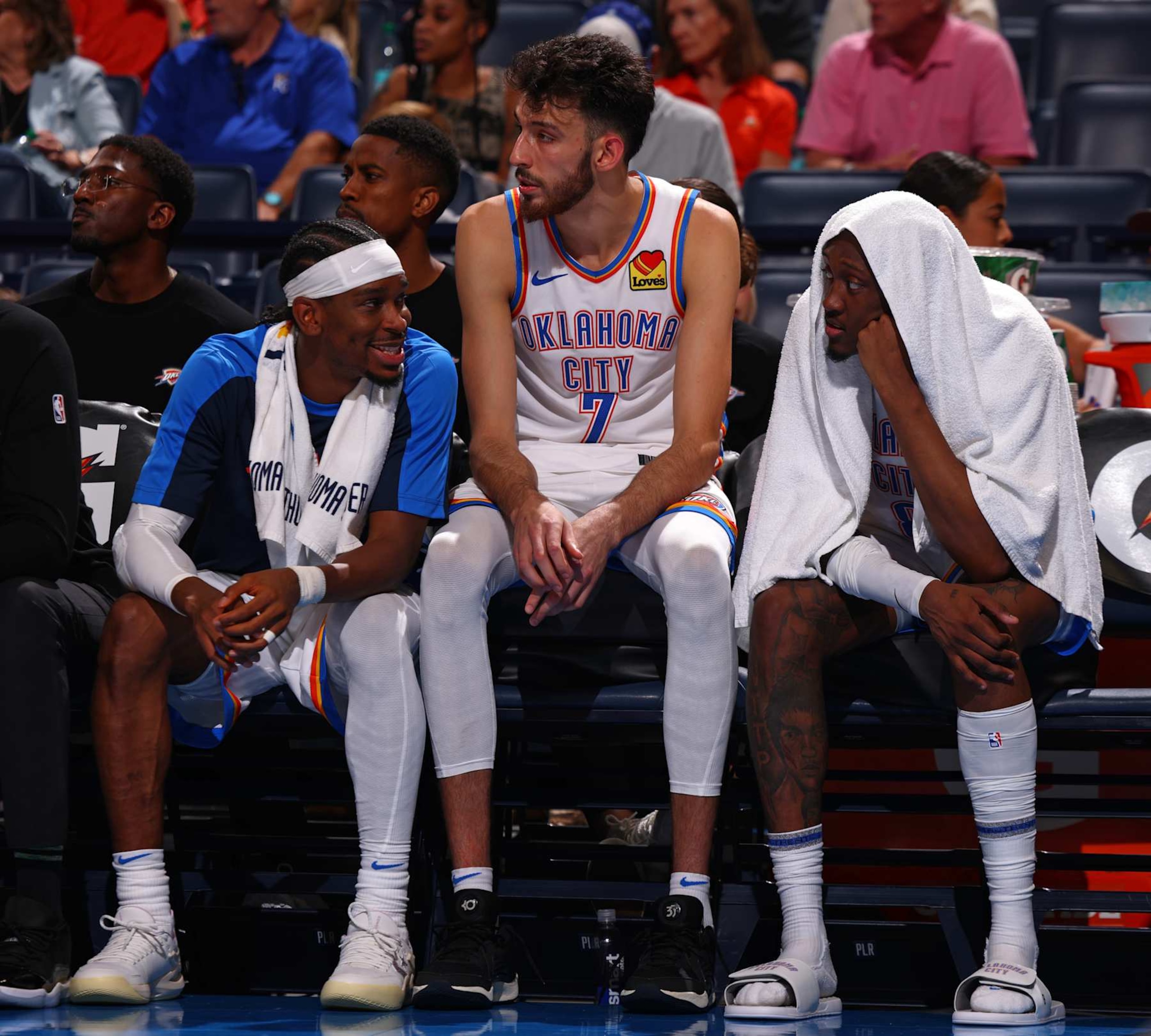 OKLAHOMA CITY, OK - OCTOBER 9: Shai Gilgeous-Alexander #2, Chet Holmgren #7, and Jalen Williams #8 of the Oklahoma City Thunder talk during the game against the Houston Rockets during a NBA pre season game on October 9, 2024 at Paycom Center in Oklahoma City, Oklahoma. NOTE TO USER: User expressly acknowledges and agrees that, by downloading and or using this photograph, User is consenting to the terms and conditions of the Getty Images License Agreement. Mandatory Copyright Notice: Copyright 2024 NBAE (Photo by Zach Beeker/NBAE via Getty Images) OKLAHOMA CITY, OK - OCTOBER 9: Shai Gilgeous-Alexander #2, Chet Holmgren #7, and Jalen Williams #8 of the Oklahoma City Thunder talk during the game against the Houston Rockets during a NBA pre season game on October 9, 2024 at Paycom Center in Oklahoma City, Oklahoma. NOTE TO USER: User expressly acknowledges and agrees that, by downloading and or using this photograph, User is consenting to the terms and conditions of the Getty Images License Agreement. Mandatory Copyright Notice: Copyright 2024 NBAE (Photo by Zach Beeker/NBAE via Getty Images)