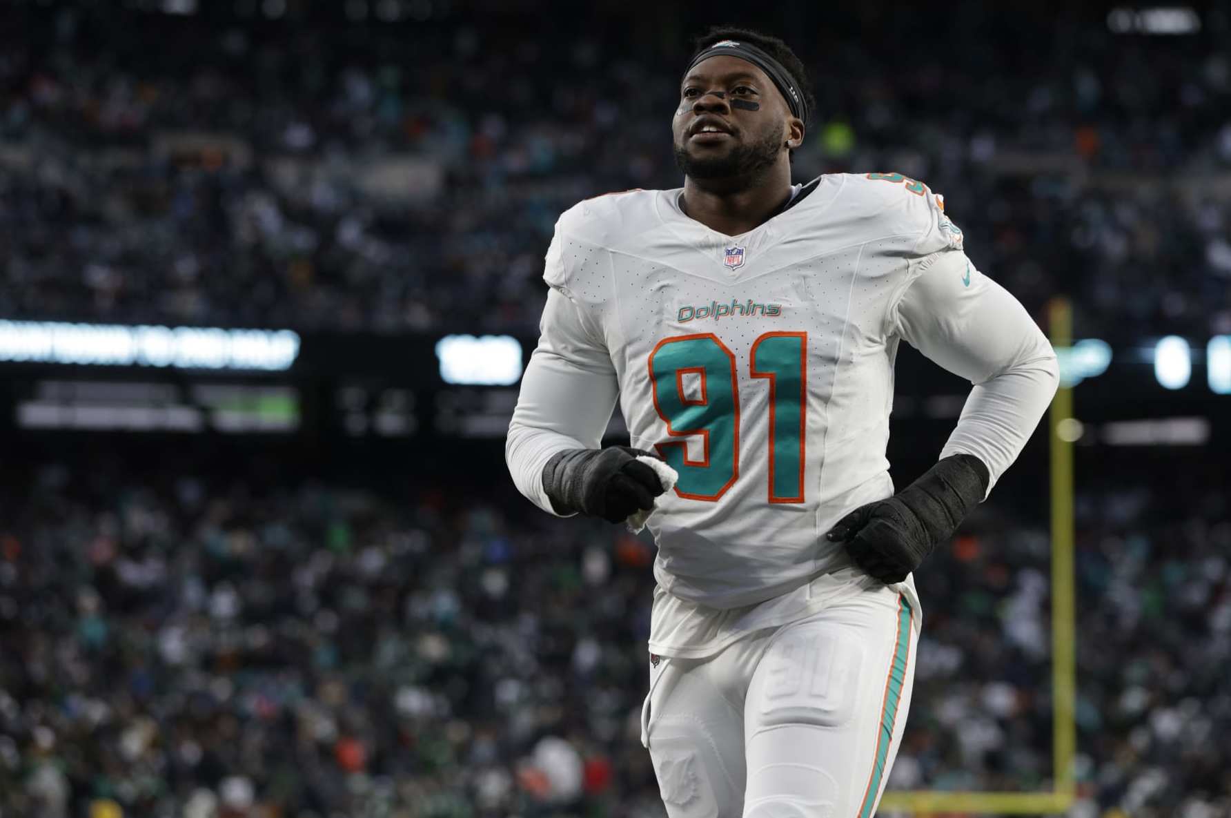 EAST RUTHERFORD, NEW JERSEY - NOVEMBER 24: Defensive end Emmanuel Ogbah #91 of the Miami Dolphins walks off the field at the end of the first half of a football game against the New York Jets at MetLife Stadium on November 24, 2023 in East Rutherford, New Jersey. (Photo by Rich Schultz/Getty Images)