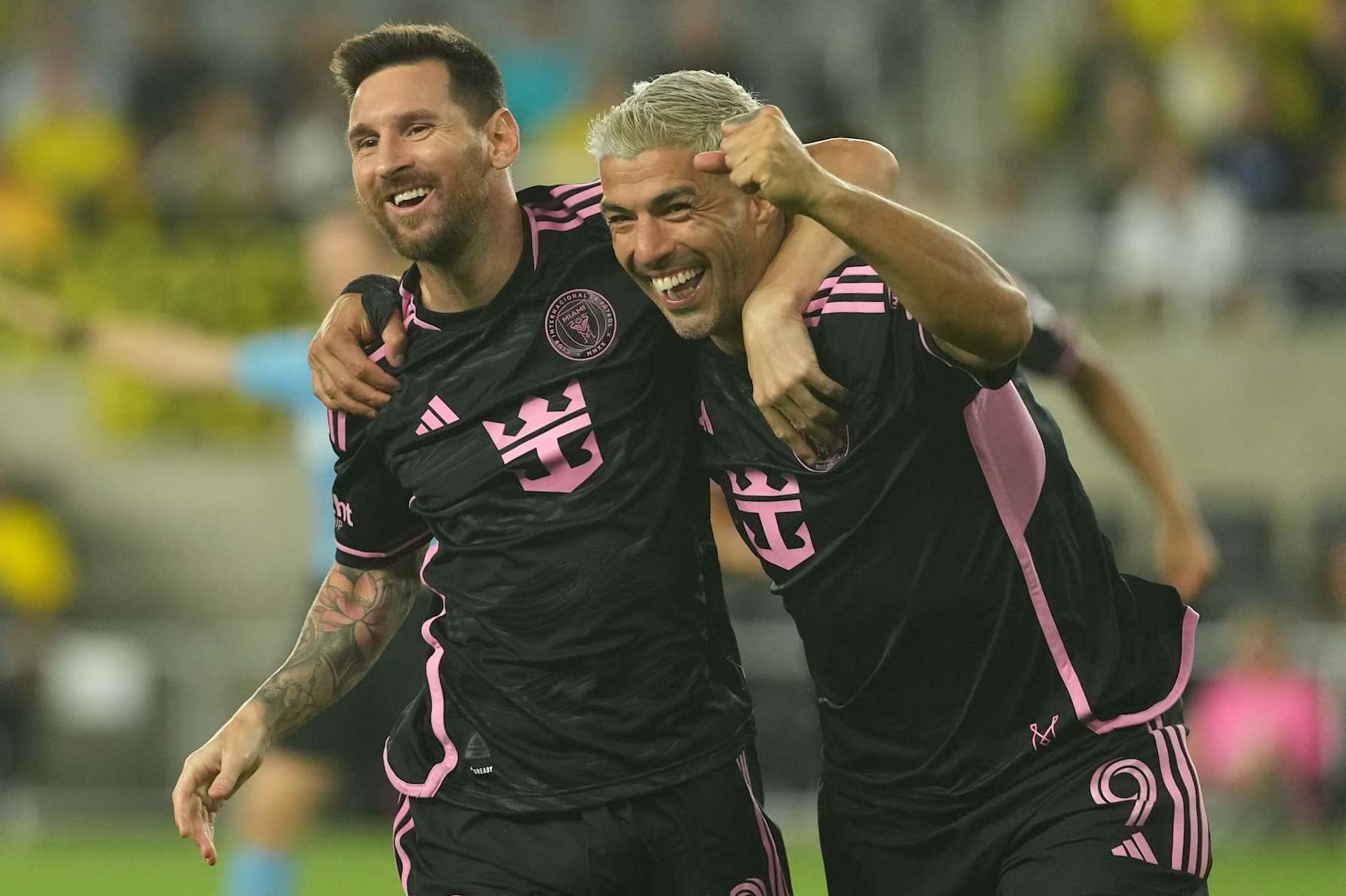 COLUMBUS, OHIO - OCTOBER 02: Lionel Messi #10 and Luis Suarez #9 of Inter Miami CF celebrate a goal in the second half against the Columbus Crew at Lower.com Field on October 02, 2024 in Columbus, Ohio. (Photo by Jason Mowry/Getty Images)