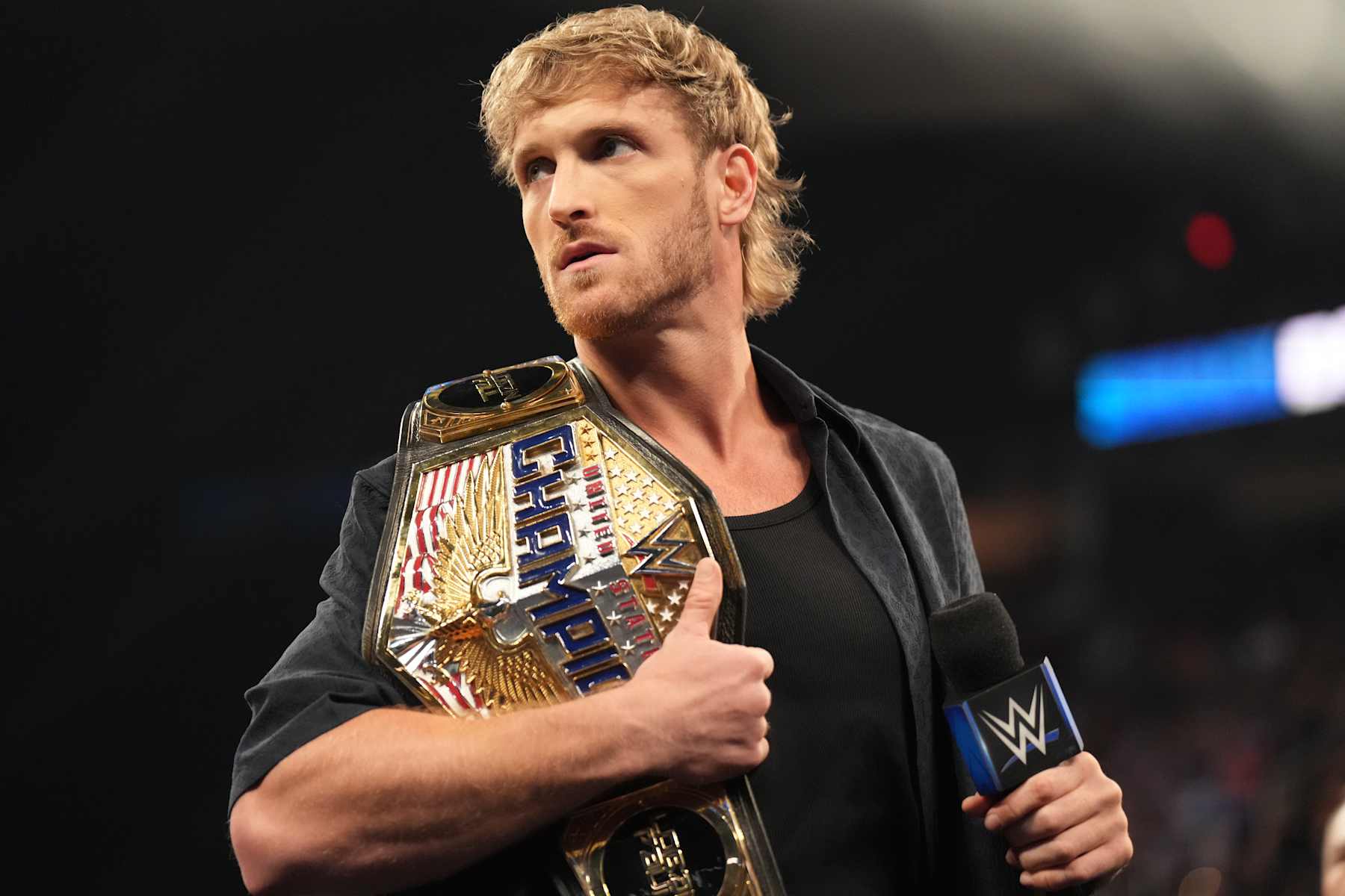 CLEVELAND, OHIO - AUGUST 2: United States Champion Logan Paul addresses the crowd during SmackDown at Rocket Mortgage FieldHouse on August 2, 2024 in Cleveland, Ohio. (Photo by WWE/Getty Images) CLEVELAND, OHIO - AUGUST 2: United States Champion Logan Paul addresses the crowd during SmackDown at Rocket Mortgage FieldHouse on August 2, 2024 in Cleveland, Ohio. (Photo by WWE/Getty Images)