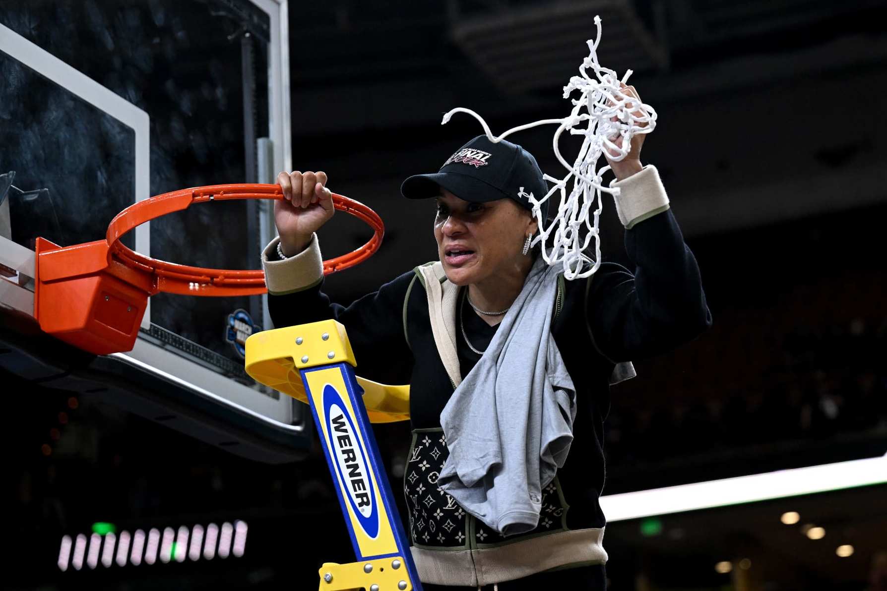 GREENVILLE, SOUTH CAROLINA - MARCH 27: Head coach Dawn Staley of the South Carolina Gamecocks cuts down the net after a win against the Maryland Terrapins during the Elite Eight round of the 2023 NCAA Women's Basketball Tournament held at Bon Secours Wellness Arena on March 27, 2023 in Greenville, South Carolina. (Photo by Grant Halverson/NCAA Photos via Getty Images)