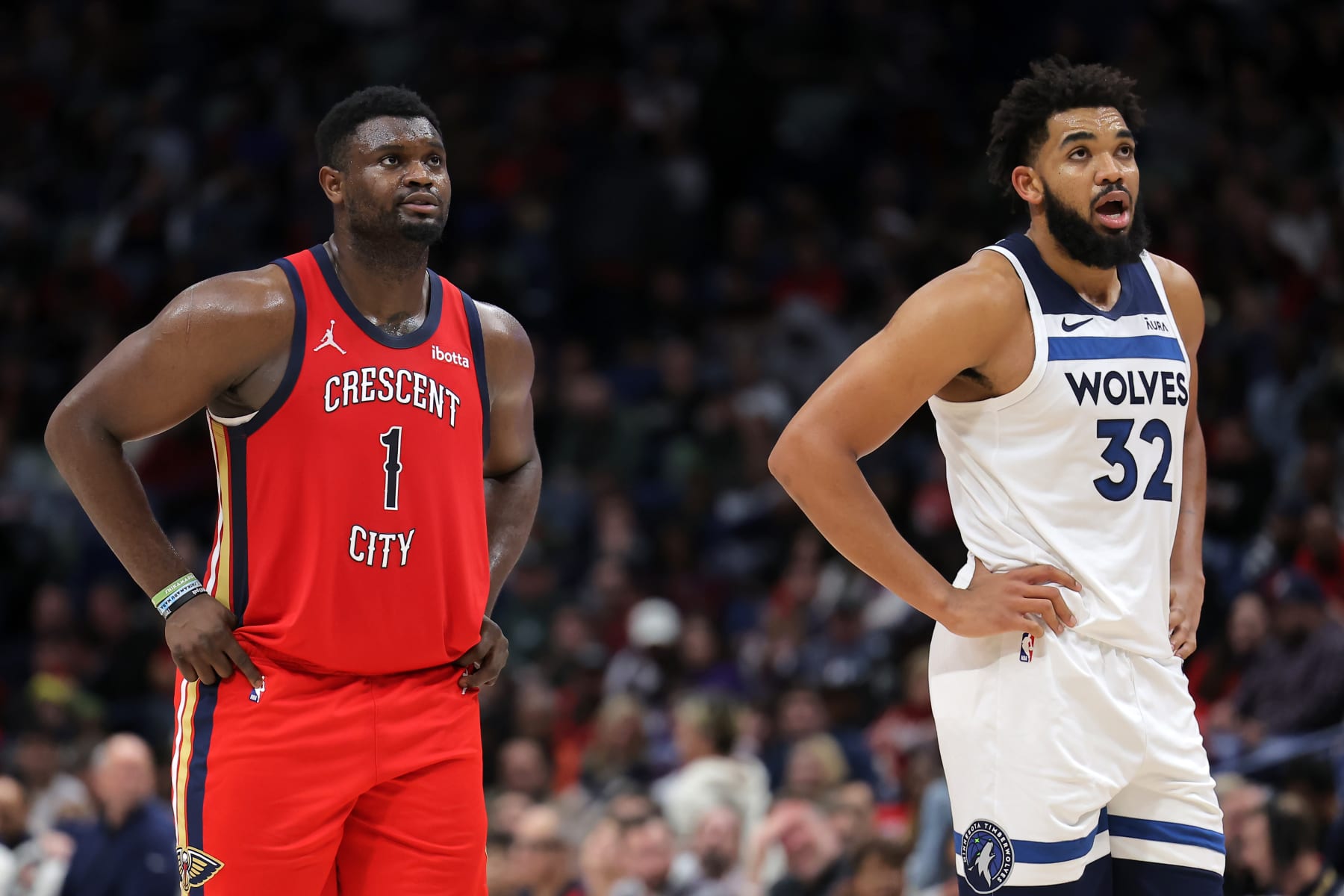 NEW ORLEANS, LOUISIANA - DECEMBER 11: Zion Williamson #1 of the New Orleans Pelicans and Karl-Anthony Towns #32 of the Minnesota Timberwolves react during the first half at the Smoothie King Center on December 11, 2023 in New Orleans, Louisiana. NOTE TO USER: User expressly acknowledges and agrees that, by downloading and or using this Photograph, user is consenting to the terms and conditions of the Getty Images License Agreement. (Photo by Jonathan Bachman/Getty Images)
