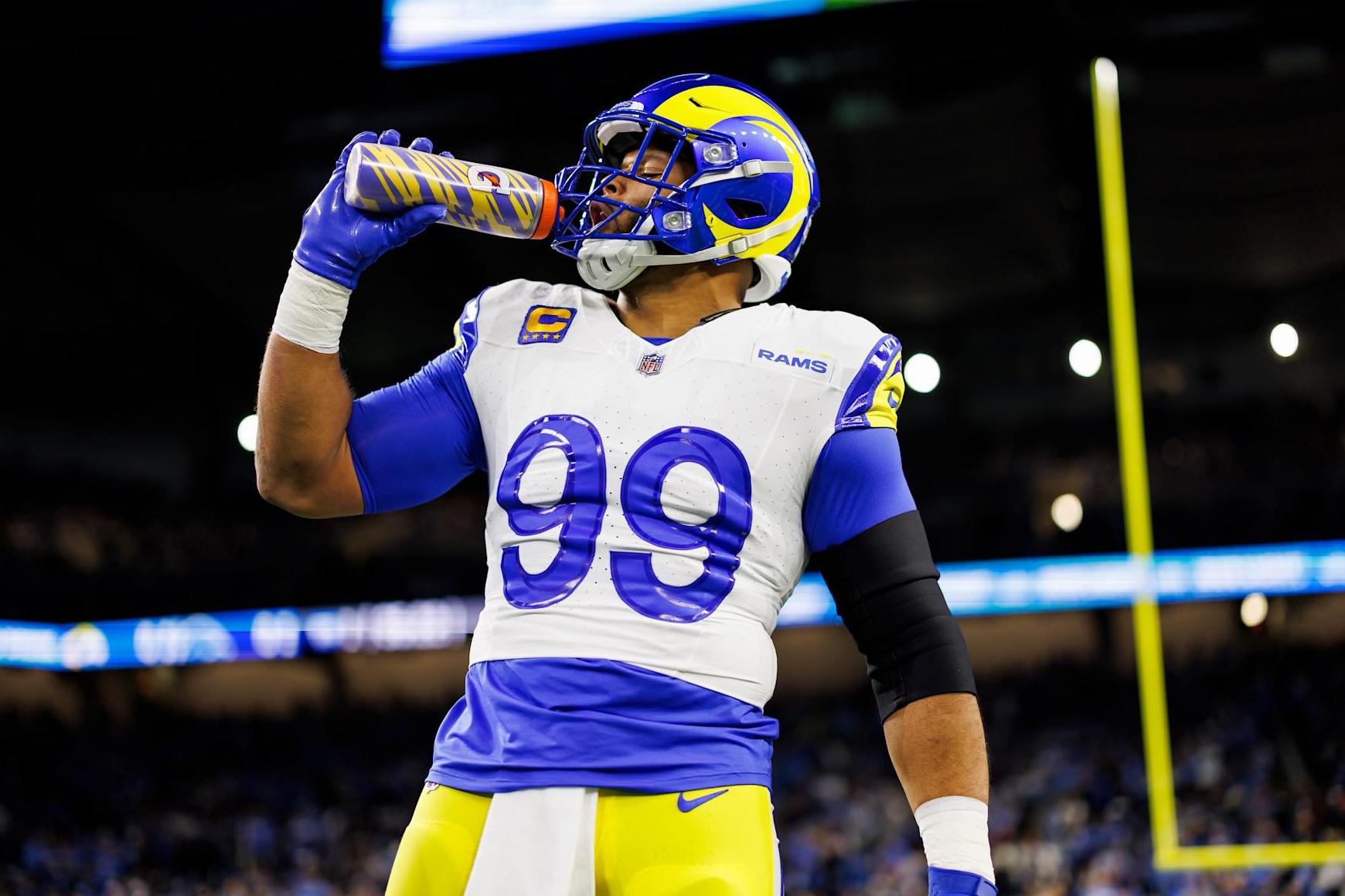 DETROIT, MICHIGAN - JANUARY 14: Aaron Donald #99 of the Los Angeles Rams drinks from a Gatorade water bottle during pregame warmups prior to an NFC Wild Card Playoff football game against the Detroit Lions at Ford Field on January 14, 2024 in Detroit, Michigan. (Photo by Ryan Kang/Getty Images)