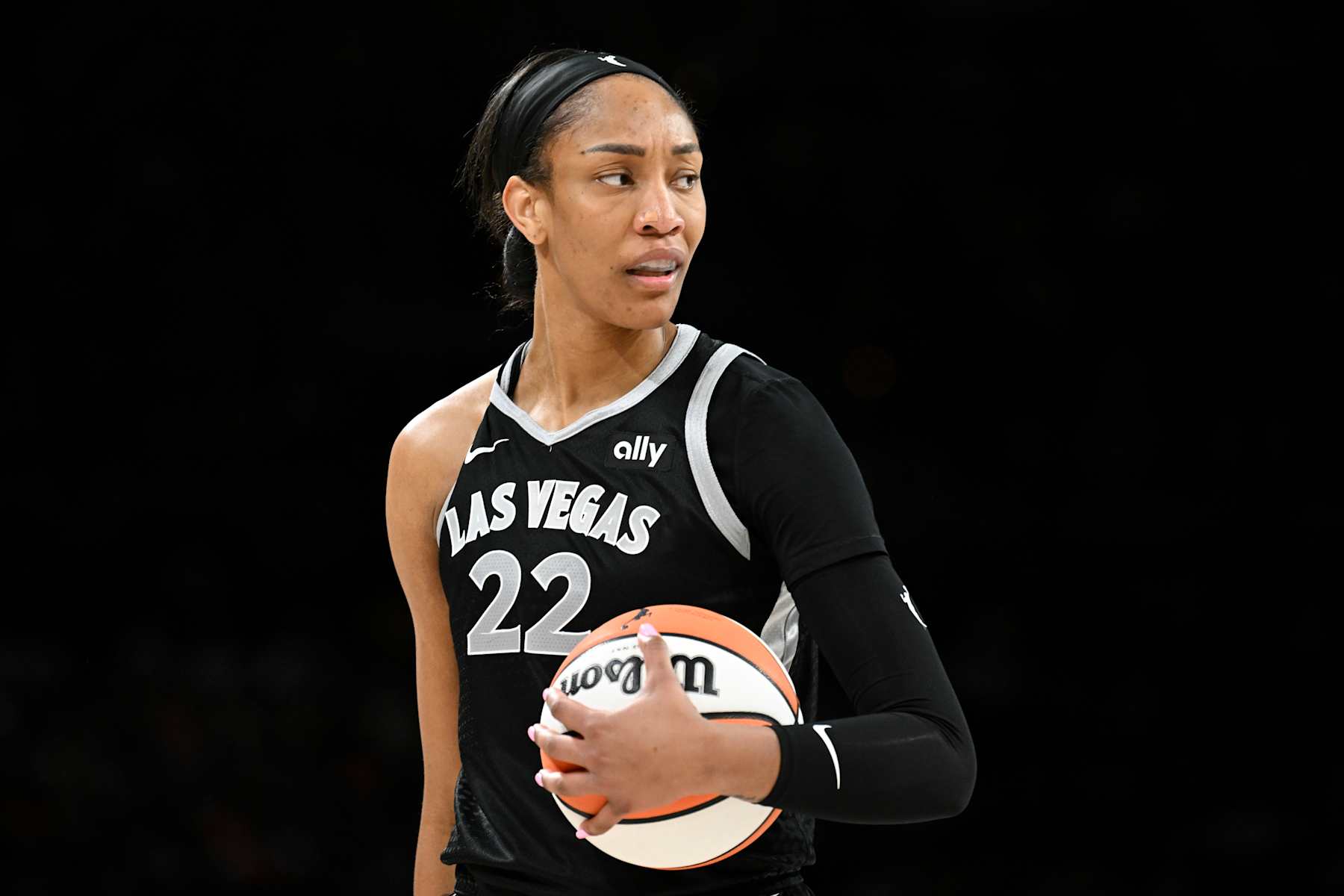LAS VEGAS, NEVADA - AUGUST 30: A'ja Wilson #22 of the Las Vegas Aces looks on in the third quarter of a game against the Atlanta Dream at Michelob ULTRA Arena on August 30, 2024 in Las Vegas, Nevada. The Aces defeated the Dream 83-72. NOTE TO USER: User expressly acknowledges and agrees that, by downloading and or using this photograph, User is consenting to the terms and conditions of the Getty Images License Agreement. (Photo by Candice Ward/Getty Images)