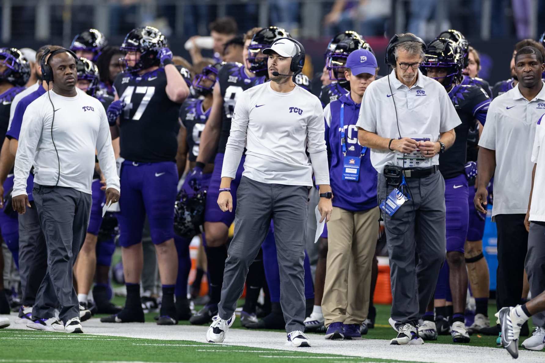 ARLINGTON, TX - DECEMBER 03: TCU offensive coordinator Garrett Riley looks on from the sideline during the Big 12 Championship game between the Kansas State Wildcats and TCU Horned Frogs on December 03, 2022 at AT&T Stadium in Arlington, TX. (Photo by Matthew Visinsky/Icon Sportswire via Getty Images)