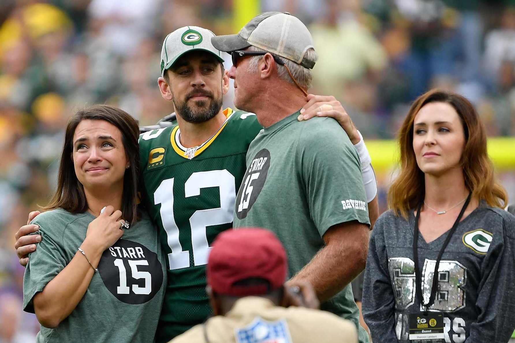 GREEN BAY, WISCONSIN - SEPTEMBER 15:  Aaron Rodgers #12 of the Green Bay Packers shares a moment with former quarterback Brett Favre during a ceremony for the late Bart Starr at halftime of the game between the Minnesota Vikings and Green Bay Packers at Lambeau Field on September 15, 2019 in Green Bay, Wisconsin. (Photo by Quinn Harris/Getty Images)
