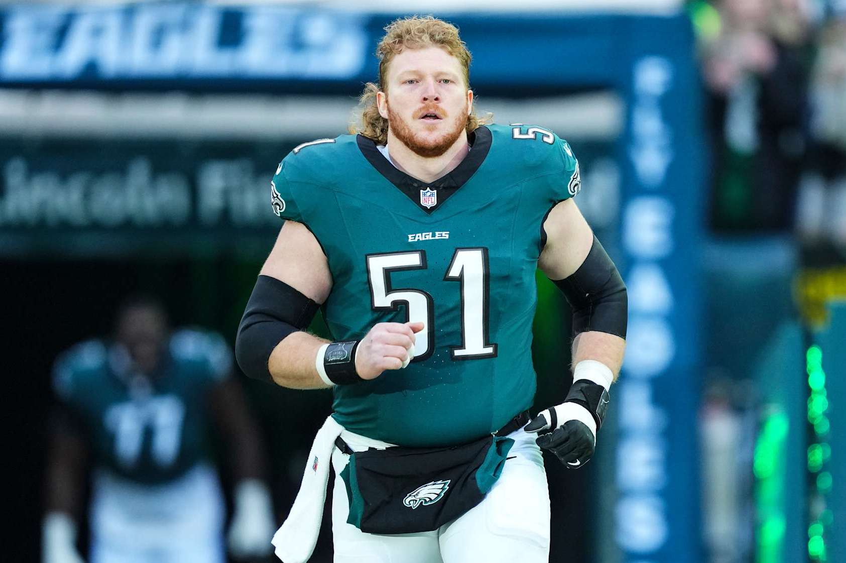 PHILADELPHIA, PA - JANUARY 12: Cam Jurgens #51 of the Philadelphia Eagles runs out of the tunnel prior to an NFL football wild card playoff game against the Green Bay Packers at Lincoln Financial Field on January 12, 2025 in Philadelphia, Pennsylvania. (Photo by Cooper Neill/Getty Images)