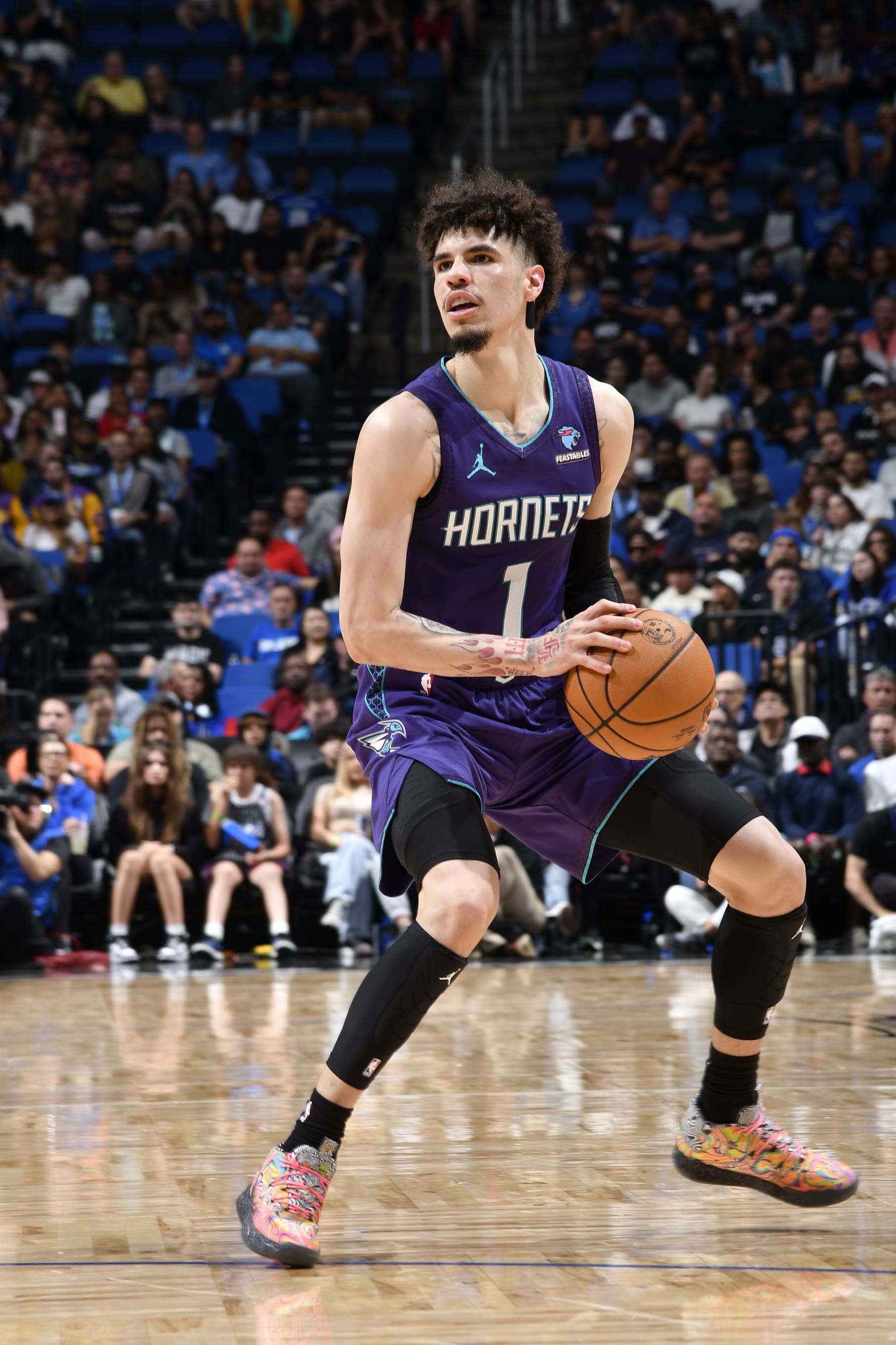 ORLANDO, FL - NOVEMBER 26: LaMelo Ball #1 of the Charlotte Hornets handles the ball during the game against the Orlando Magic on November 26, 2023 at Amway Center in Orlando, Florida. NOTE TO USER: User expressly acknowledges and agrees that, by downloading and or using this photograph, User is consenting to the terms and conditions of the Getty Images License Agreement. Mandatory Copyright Notice: Copyright 2023 NBAE (Photo by Fernando Medina/NBAE via Getty Images)