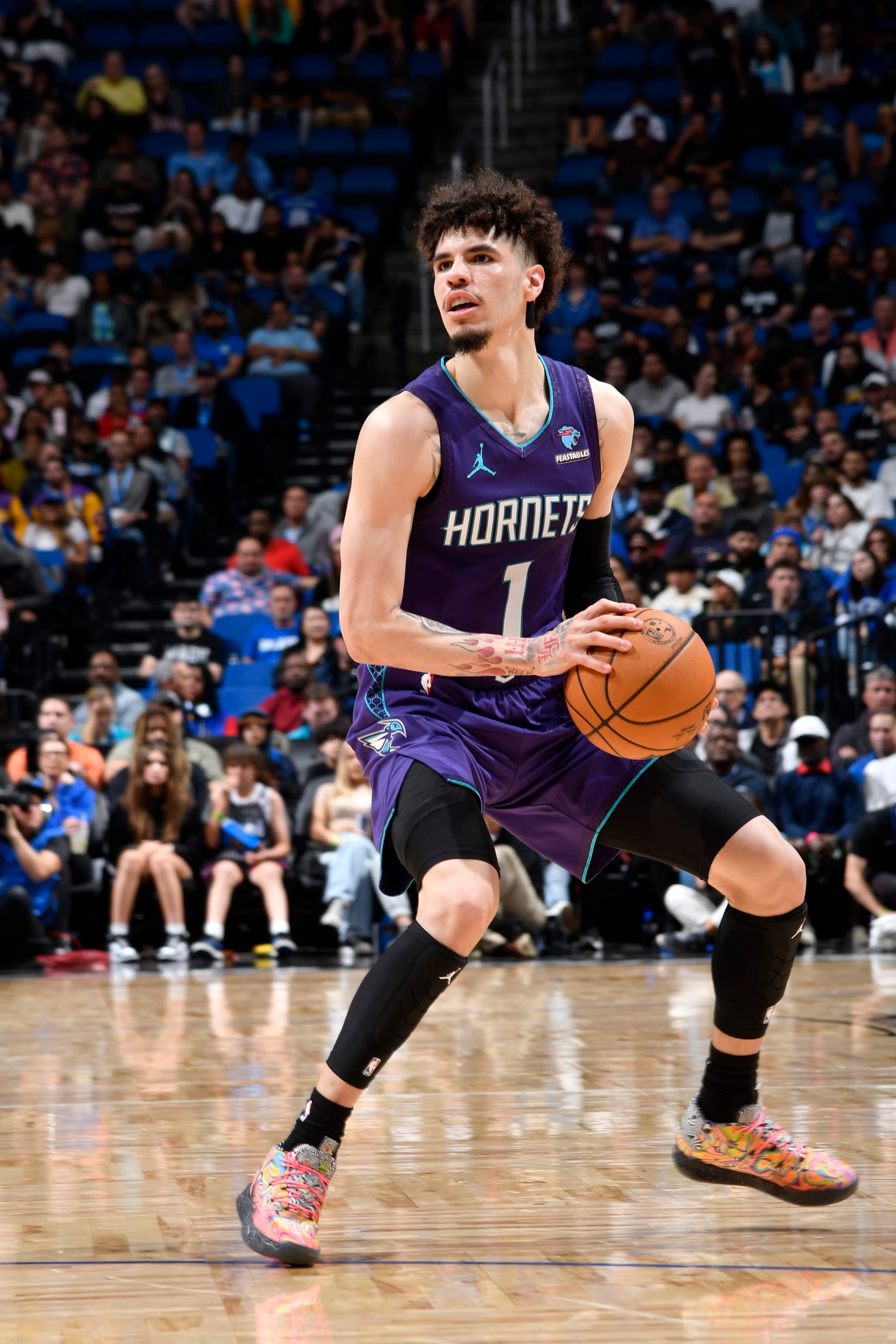ORLANDO, FL - NOVEMBER 26: LaMelo Ball #1 of the Charlotte Hornets handles the ball during the game against the Orlando Magic on November 26, 2023 at Amway Center in Orlando, Florida. NOTE TO USER: User expressly acknowledges and agrees that, by downloading and or using this photograph, User is consenting to the terms and conditions of the Getty Images License Agreement. Mandatory Copyright Notice: Copyright 2023 NBAE (Photo by Fernando Medina/NBAE via Getty Images) ORLANDO, FL - NOVEMBER 26: LaMelo Ball #1 of the Charlotte Hornets handles the ball during the game against the Orlando Magic on November 26, 2023 at Amway Center in Orlando, Florida. NOTE TO USER: User expressly acknowledges and agrees that, by downloading and or using this photograph, User is consenting to the terms and conditions of the Getty Images License Agreement. Mandatory Copyright Notice: Copyright 2023 NBAE (Photo by Fernando Medina/NBAE via Getty Images)