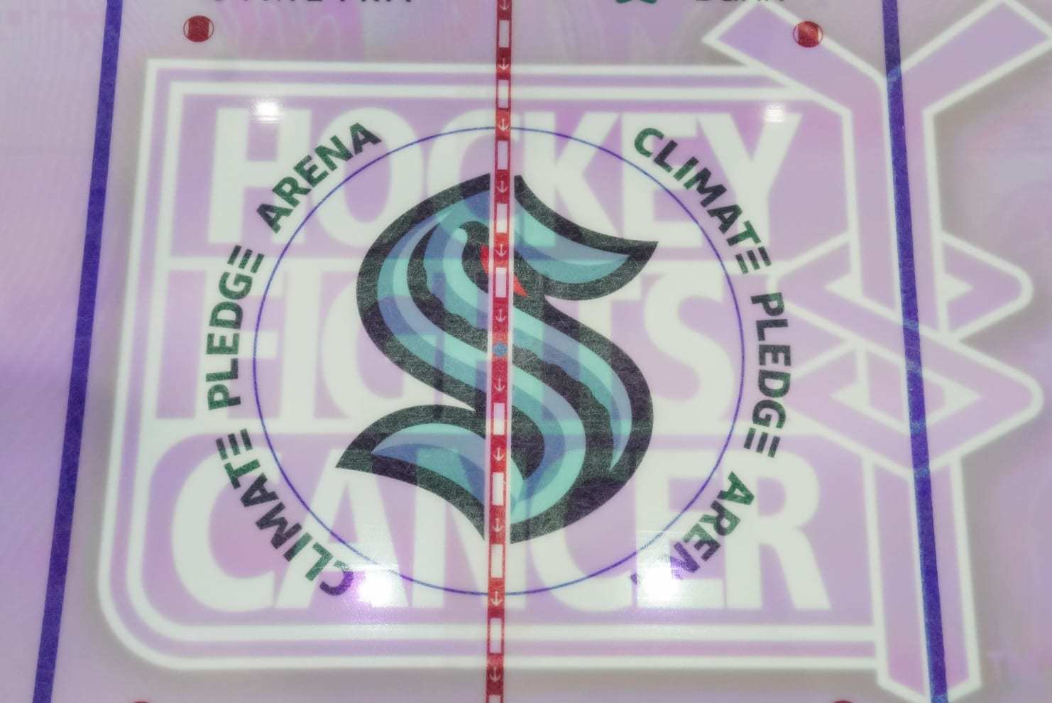 SEATTLE, WASHINGTON - NOVEMBER 21: The Hockey Fights Cancer logo is projected on the ice prior to a game between the Washington Capitals and the Seattle Kraken at Climate Pledge Arena on November 21, 2021 in Seattle, Washington. (Photo by Christopher Mast/NHLI via Getty Images)