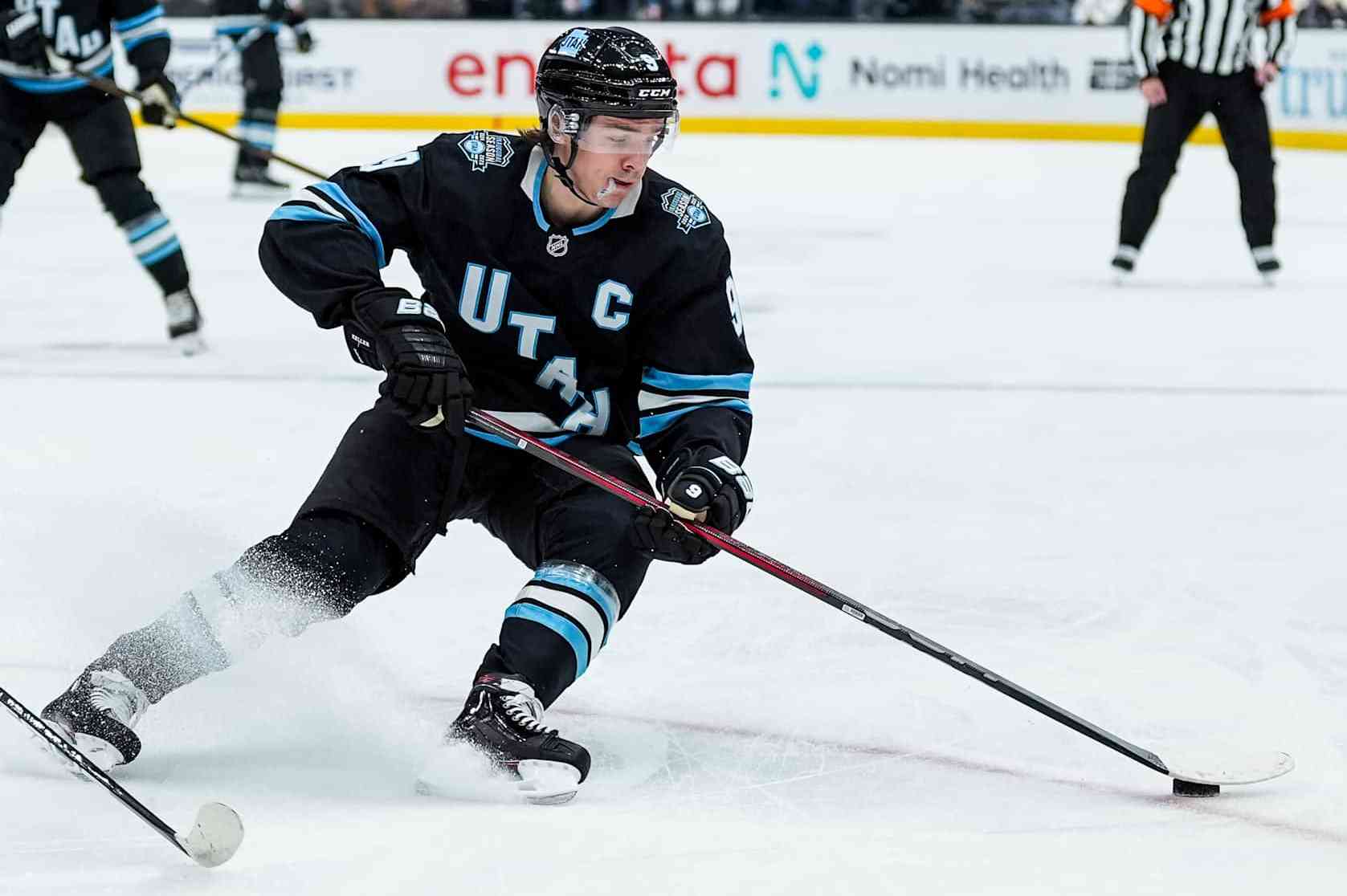 SALT LAKE CITY , UTAH - DECEMBER 10: Clayton Keller #9 of the Utah Hockey Club skates with the puck during the first period against the Minnesota Wild on December 10, 2024 at Delta Center in Salt Lake City, Utah. (Photo by Hunter Dyke/NHLI via Getty Images)