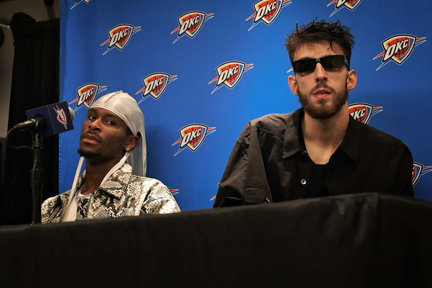INGLEWOOD, CA - NOVEMBER 2: Shai Gilgeous-Alexander #2 and Chet Holmgren #7 of the Oklahoma City Thunder look on during a press conference after the game against the LA Clippers on November 2, 2024 at Intuit Dome in Los Angeles, California. NOTE TO USER: User expressly acknowledges and agrees that, by downloading and/or using this Photograph, user is consenting to the terms and conditions of the Getty Images License Agreement. Mandatory Copyright Notice: Copyright 2024 NBAE (Photo by Jim Poorten/NBAE via Getty Images)
