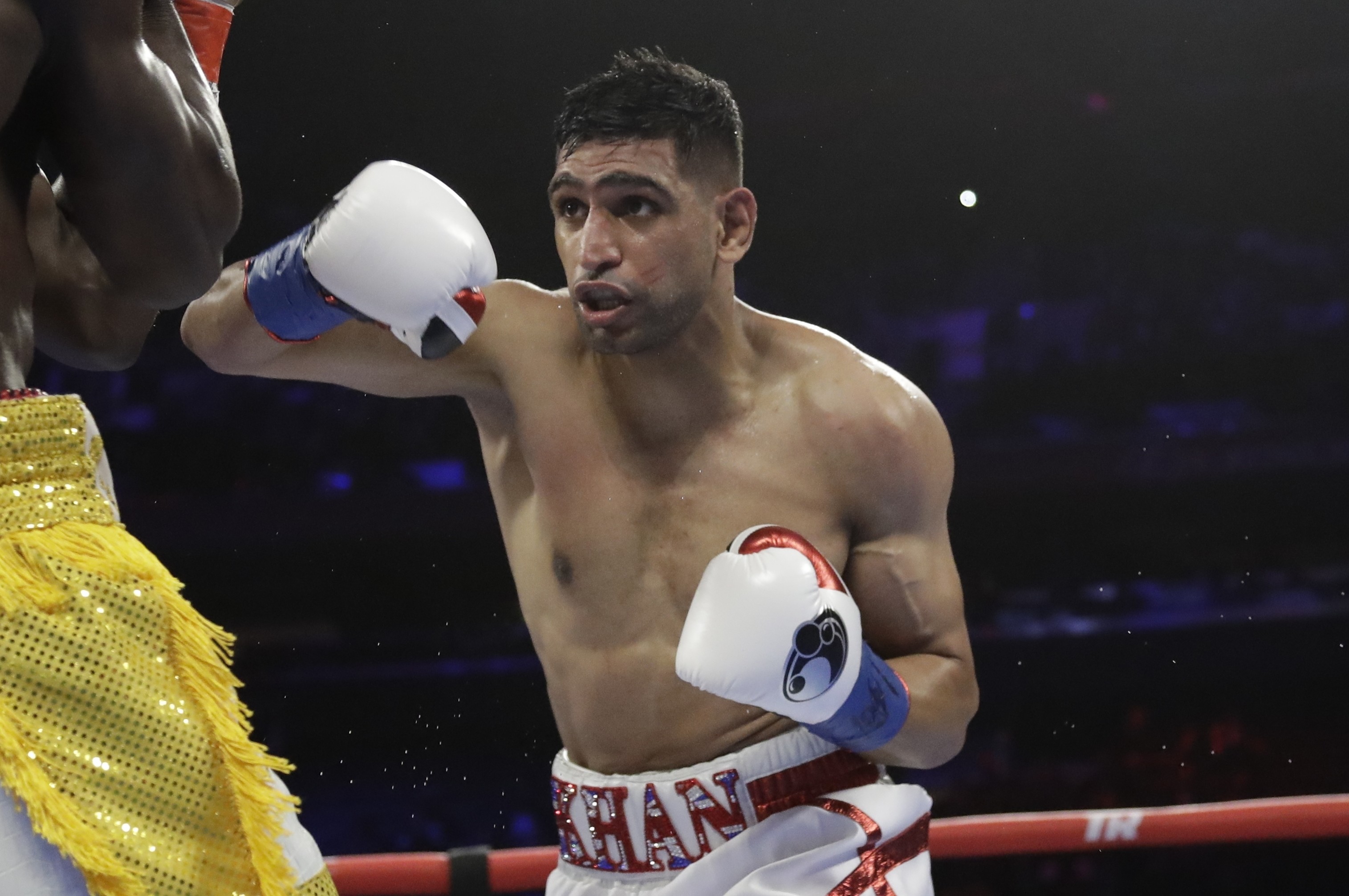England's Amir Khan, right, during the second round of a WBO world welterweight championship boxing match against Terence Crawford Sunday, April 21, 2019, in New York. Crawford won the fight. (AP Photo/Frank Franklin II)