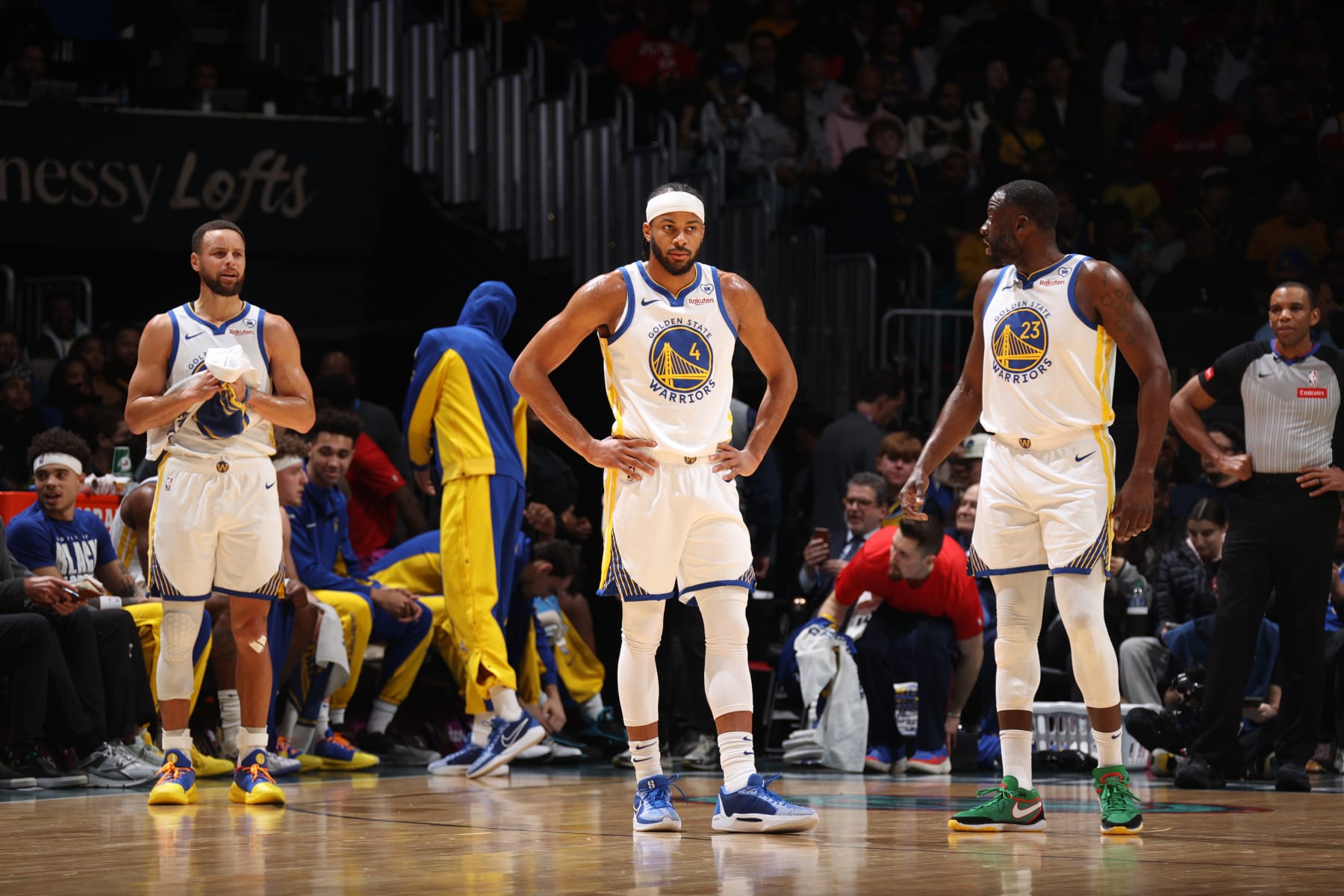 WASHINGTON, DC -  FEBRUARY 27: Stephen Curry #30, Moses Moody #4 and Draymond Green #23 of the Golden State Warriors look on during the game against the Washington Wizards on February 27, 2024 at Capital One Arena in Washington, DC. NOTE TO USER: User expressly acknowledges and agrees that, by downloading and or using this Photograph, user is consenting to the terms and conditions of the Getty Images License Agreement. Mandatory Copyright Notice: Copyright 2024 NBAE (Photo by Stephen Gosling/NBAE via Getty Images)