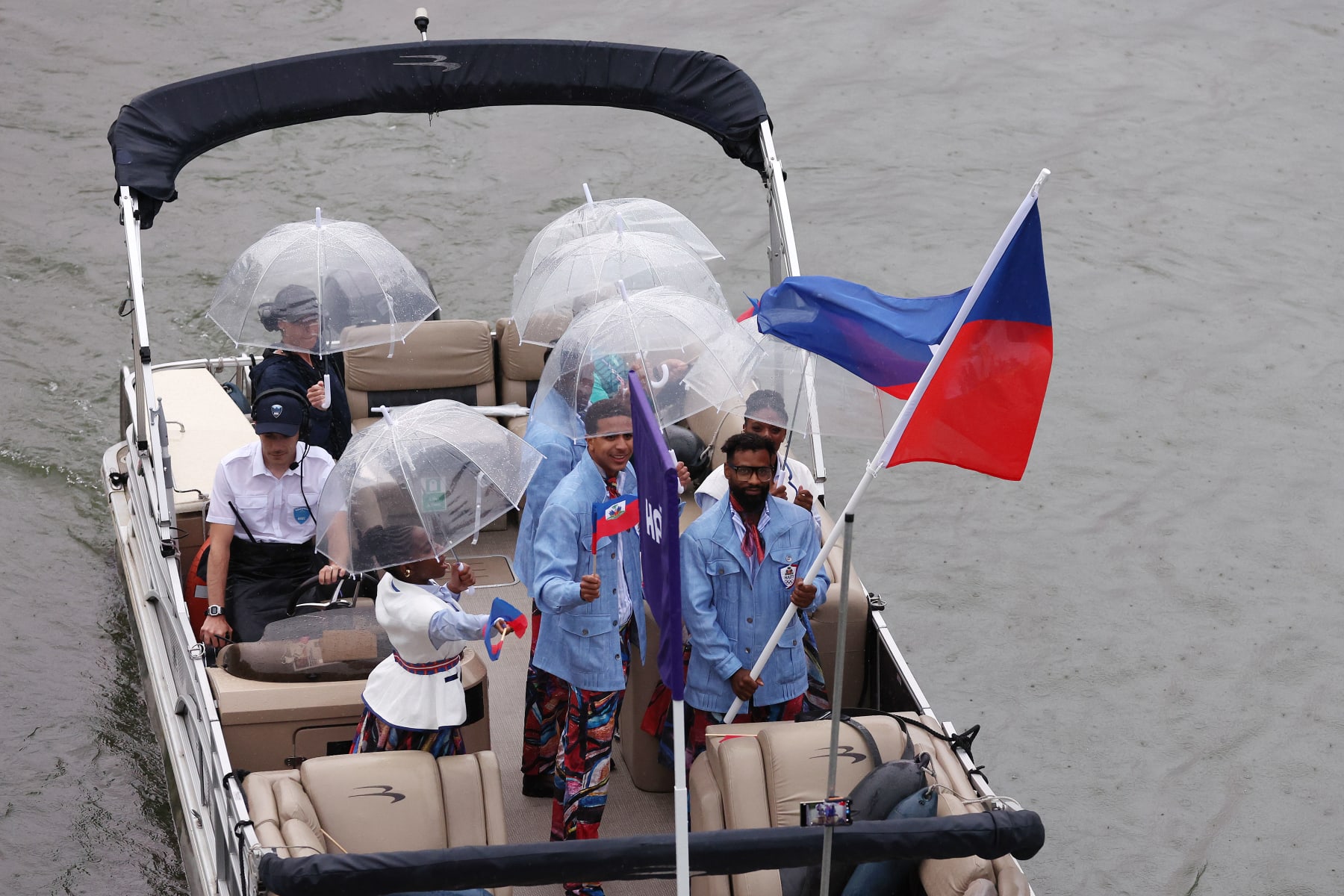 PARIS, FRANCE - JULY 26: Team Haiti are seen on a boat on the River Seine during the opening ceremony of the Olympic Games Paris 2024 on July 26, 2024 in Paris, France. (Photo by Lars Baron/Getty Images)