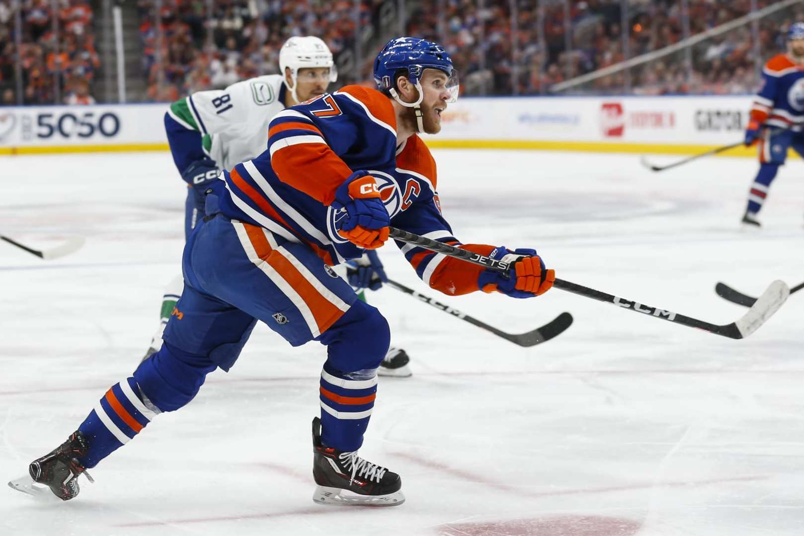 EDMONTON, CANADA - MAY 18: Connor McDavid #97 of the Edmonton Oilers takes a shot against the Vancouver Canucks during the second period of Game Six in the Second Round of the 2024 Stanley Cup Playoffs at Rogers Place on May 18, 2024 in Edmonton, Canada. (Photo by Codie McLachlan/Getty Images)