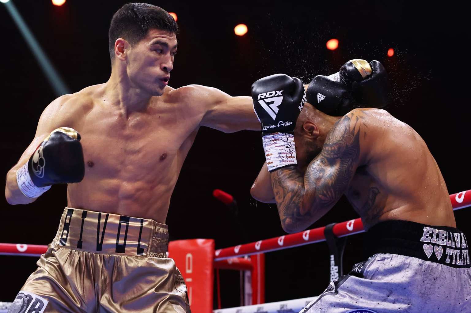 RIYADH, SAUDI ARABIA - DECEMBER 23: Dmitry Bivol punches Lyndon Arthur during the IBO and WBA Super World Light Heavyweight title fight between Dmitry Bivol and Lyndon Arthur during the Day of Reckoning: Fight Night at Kingdom Arena on December 23, 2023 in Riyadh, Saudi Arabia. (Photo by Richard Pelham/Getty Images)