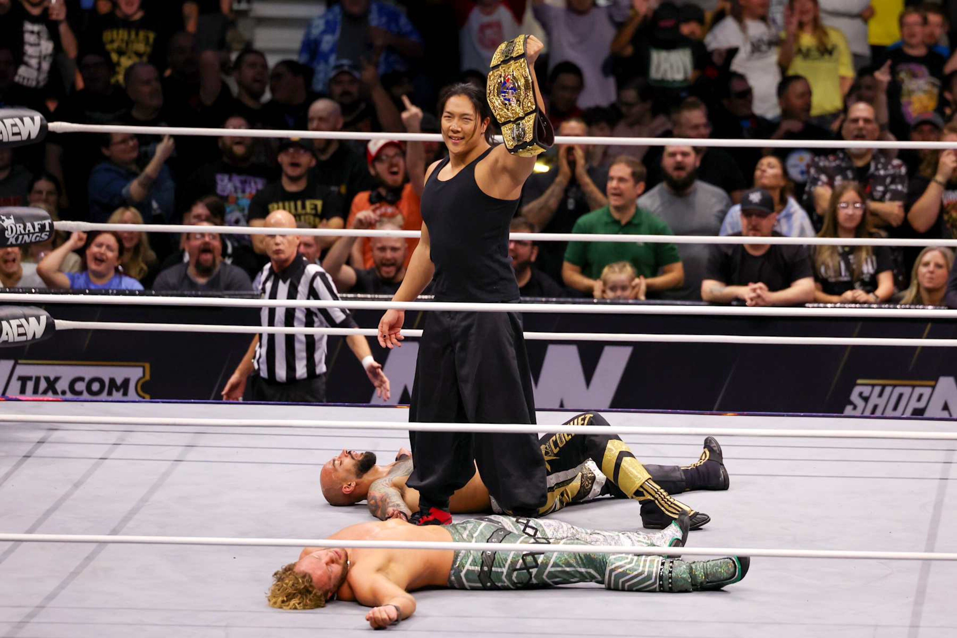 PITTSBURGH, PA - OCTOBER 02: Konosuke Takeshita holds the AEW International Champion belt over Will Ospreay and Ricochet during AEW Dynamite on October 2, 2024, at the Petersen Events Center in Pittsburgh, PA. (Photo by Frank Jansky/Icon Sportswire via Getty Images)