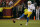 Los Angeles Chargers place kicker Dustin Hopkins kicks an onside kick during the second half of an NFL football game against the Kansas City Chiefs Thursday, Sept. 15, 2022, in Kansas City, Mo. (AP Photo/Charlie Riedel)
