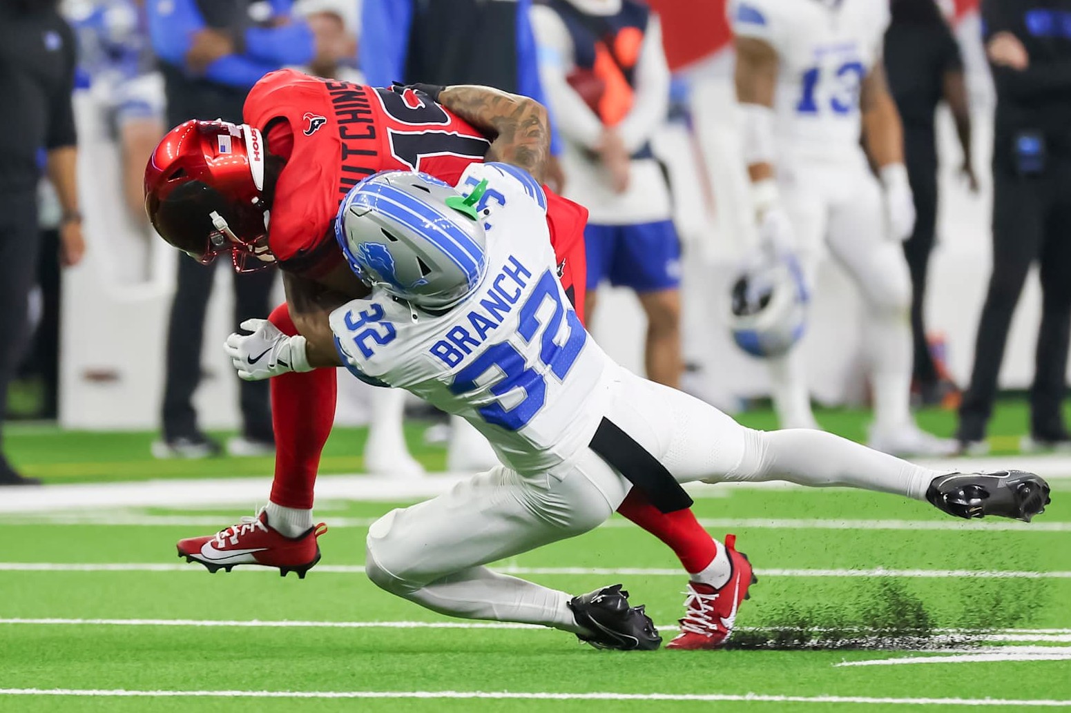Detroit Lions safety Brian Branch tackles Houston Texans wide receiver Xavier Hutchinson. Detroit Lions safety Brian Branch tackles Houston Texans wide receiver Xavier Hutchinson.