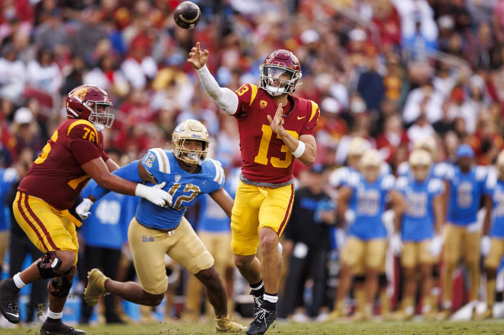 LOS ANGELES, CALIFORNIA - NOVEMBER 18: Caleb Williams #13 of the USC Trojans drops back and looks to throw a pass during the first half of a game against the UCLA Bruins at United Airlines Field at the Los Angeles Memorial Coliseum on November 18, 2023 in Los Angeles, California. (Photo by Ryan Kang/Getty Images)