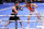 NEW YORK, NEW YORK - APRIL 30: Katie Taylor of Ireland (black trunks) gets hit by Amanda Serrano of Puerto Rico (white trunks) during their world lightweight championship fight. Taylor would win by split decision to remain the undisputed lightweight champion of the world and retain her WBA, WBC, IBF, WBO, and The Ring lightweight titles at Madison Square Garden on April 30, 2022 in New York, New York. Taylor and Serrano made history as the first female fighters to headline a boxing event in the venue's 140-year history. (Photo by J. Yim/Getty Images)