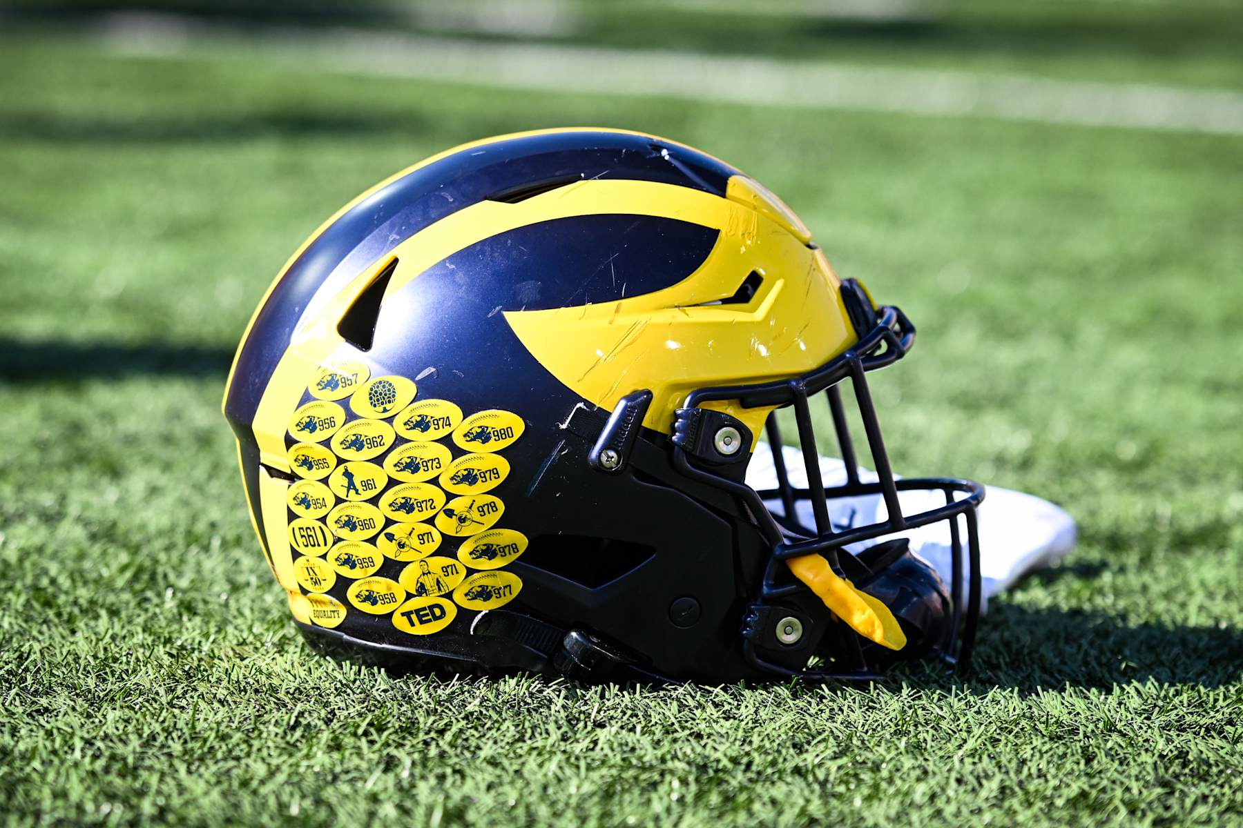 BLOOMINGTON, IN - OCTOBER 8, 2022: A Michigan football helmet lies on the field after the college football game between the University of Michigan Wolverines and the Indiana University Mountaineers at Memorial Stadium on October 8, 2022 in Bloomington, Indiana. (Photo by James Black/Icon Sportswire via Getty Images)