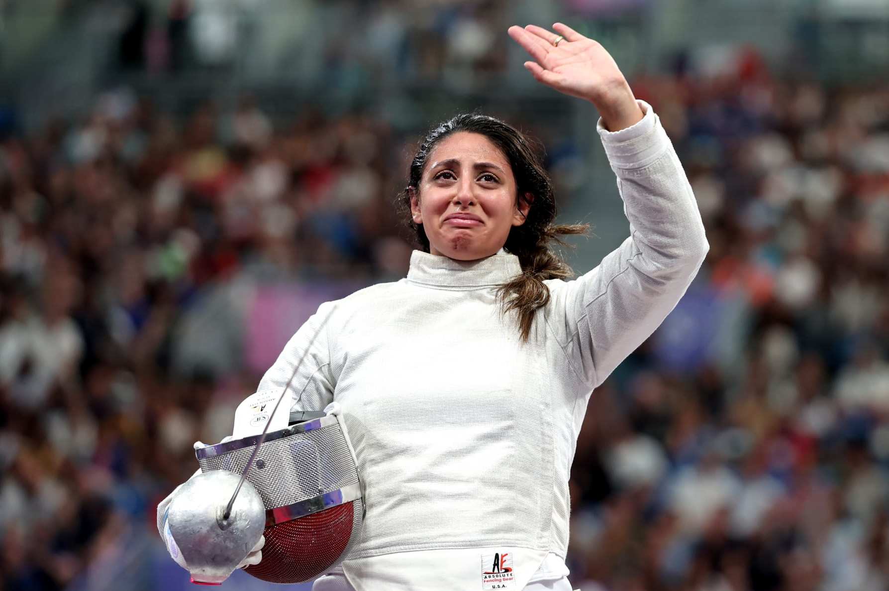 PARIS, FRANCE - JULY 29: Nada Hafez of Team Egypt applauds fans after her victory against Elizabeth Tartakovsky of Team United States (not pictured) in the Fencing Women's Sabre Individual Table of 32 on day three of the Olympic Games Paris 2024 at Grand Palais on July 29, 2024 in Paris, France. (Photo by Al Bello/Getty Images)