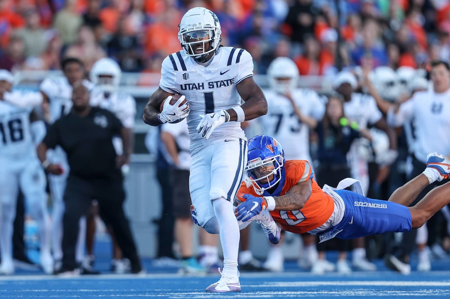 BOISE, ID - OCTOBER 5: Wide receiver Jalen Royals #1 of the Utah State Aggies catches a long touchdown pass during the first half against the Utah State Aggies at Albertsons Stadium on October 5, 2024 in Boise, Idaho. (Photo by Loren Orr/Getty Images)