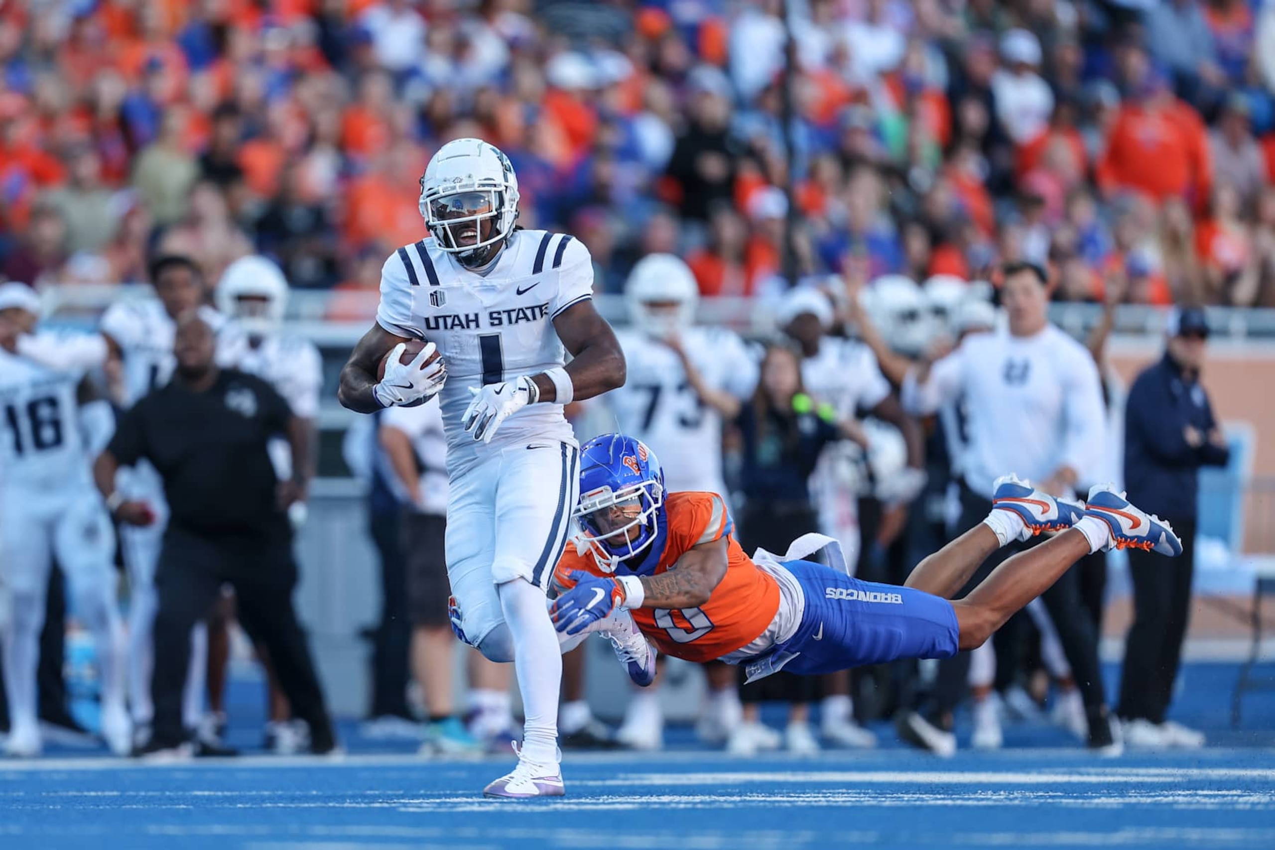 BOISE, ID - OCTOBER 5: Wide receiver Jalen Royals #1 of the Utah State Aggies catches a long touchdown pass during the first half against the Utah State Aggies at Albertsons Stadium on October 5, 2024 in Boise, Idaho. (Photo by Loren Orr/Getty Images) BOISE, ID - OCTOBER 5: Wide receiver Jalen Royals #1 of the Utah State Aggies catches a long touchdown pass during the first half against the Utah State Aggies at Albertsons Stadium on October 5, 2024 in Boise, Idaho. (Photo by Loren Orr/Getty Images)