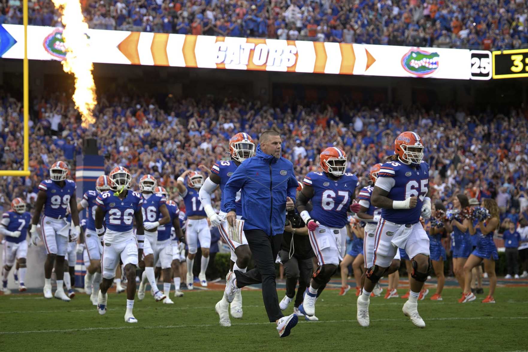 Florida head coach Billy Napier, center, leads the team onto the field before an NCAA college football game against Utah, Saturday, Sept. 3, 2022, in Gainesville, Fla. (AP Photo/Phelan M. Ebenhack)