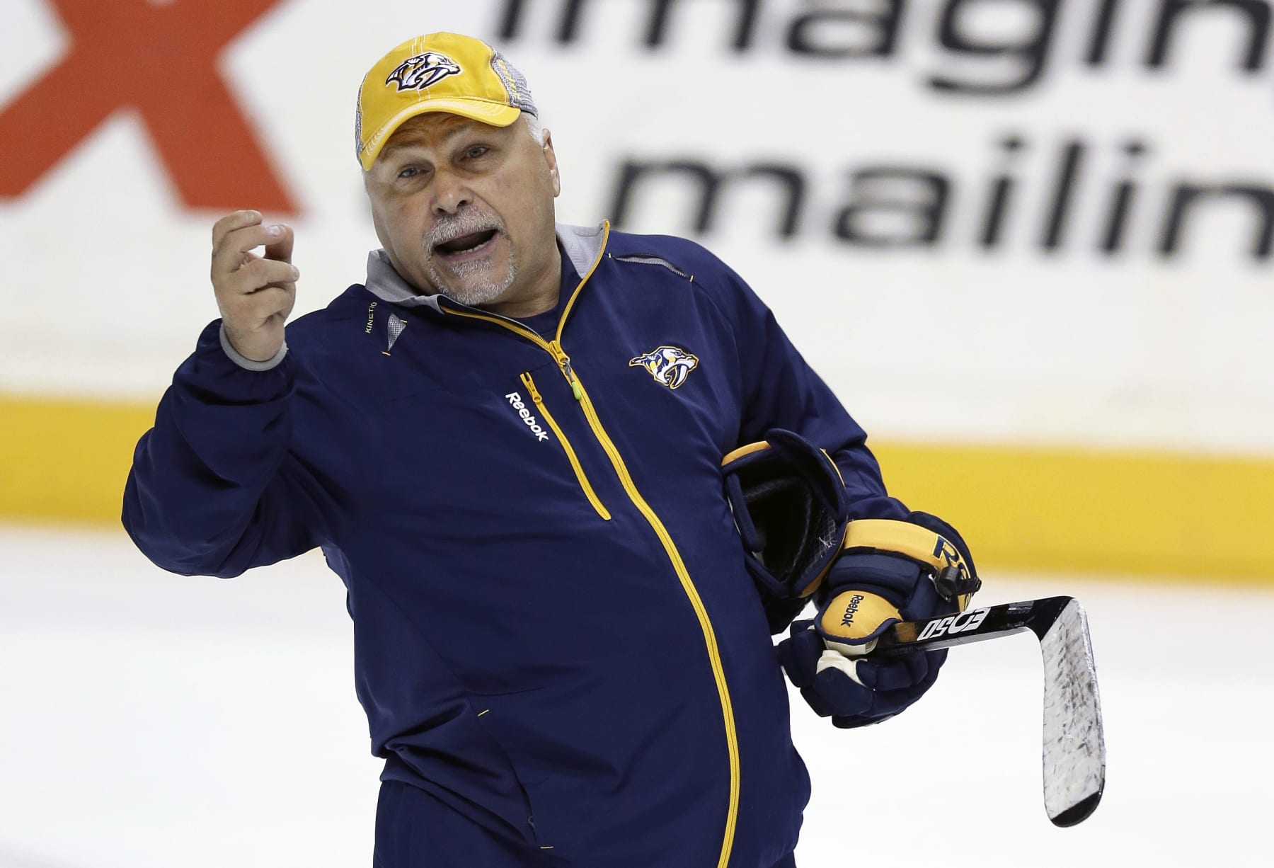 Nashville Predators head coach Barry Trotz instructs his players during NHL hockey training camp on Thursday, Sept. 12, 2013, in Nashville, Tenn. (AP Photo/Mark Humphrey)