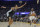 Golden State Warriors guard Chris Paul, right, is defended by San Antonio Spurs center Victor Wembanyama (1) during an NBA preseason basketball game in San Francisco, Friday, Oct. 20, 2023. (AP Photo/Jeff Chiu)