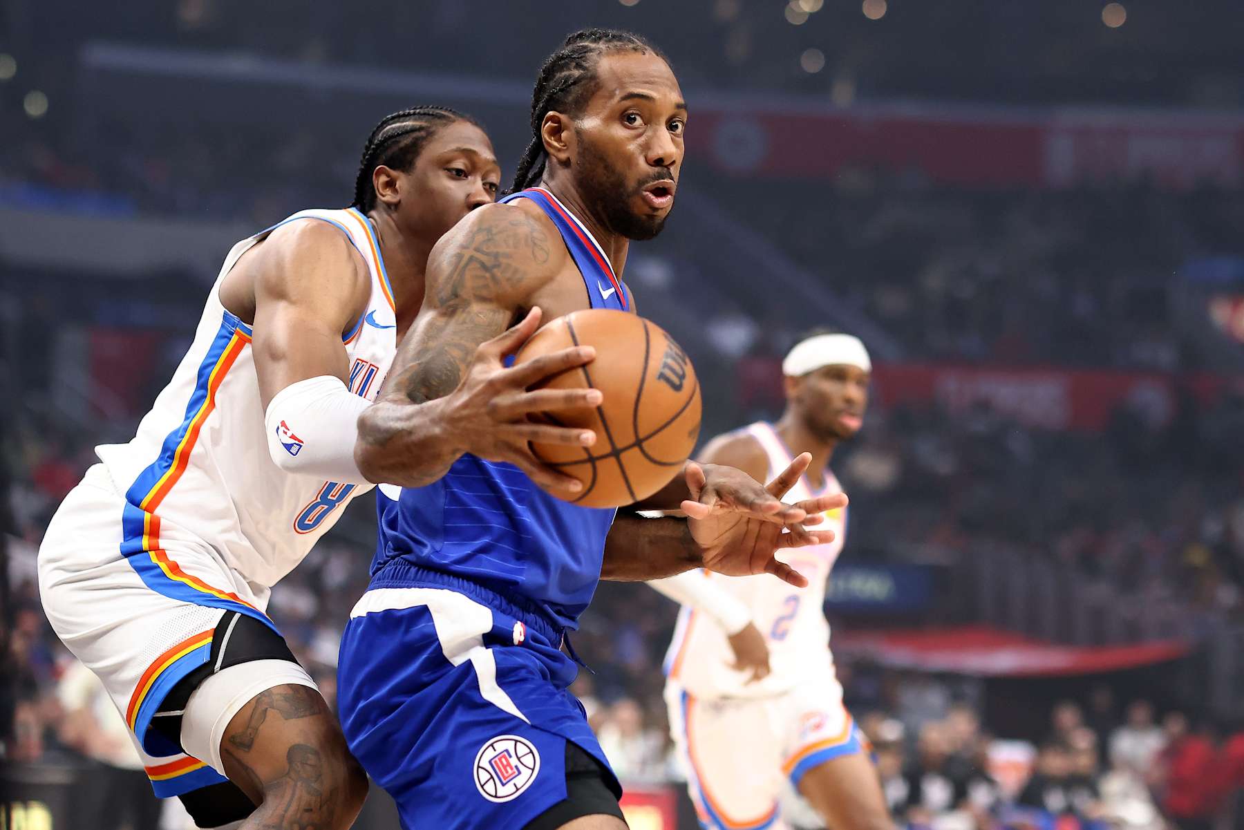 LOS ANGELES, CALIFORNIA - JANUARY 16: Kawhi Leonard #2 of the Los Angeles Clippers handles the ball against Jalen Williams #8 of the Oklahoma City Thunder during the first quarter at Crypto.com Arena on January 16, 2024 in Los Angeles, California. NOTE TO USER: User expressly acknowledges and agrees that, by downloading and or using this photograph, User is consenting to the terms and conditions of the Getty Images License Agreement. (Photo by Katelyn Mulcahy/Getty Images)