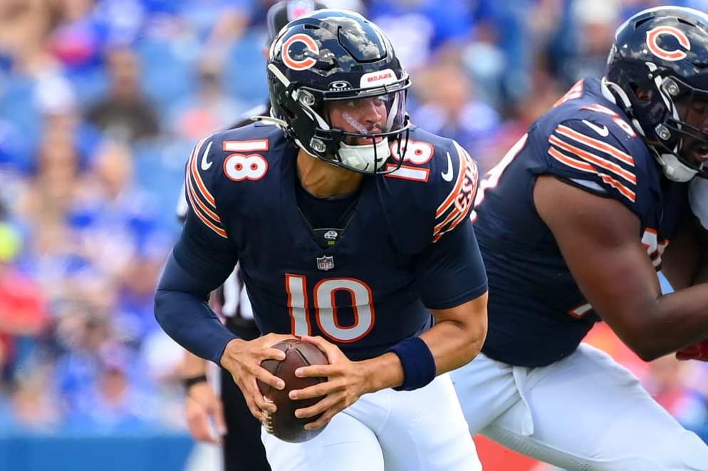 ORCHARD PARK, NEW YORK - AUGUST 10: Caleb Williams #18 of the Chicago Bears runs with the ball against the Buffalo Bills during the first half of a preseason game at Highmark Stadium on August 10, 2024 in Orchard Park, New York. (Photo by Rich Barnes/Getty Images)