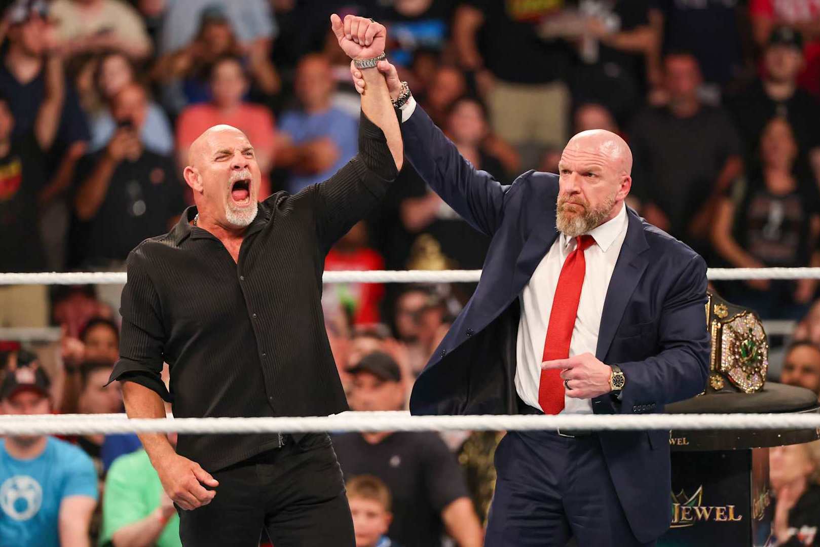 ATLANTA, GEORGIA - OCTOBER 5: Bill Goldberg poses in the ring with Triple H during Bad Blood at State Farm Arena on October 5, 2024 in Atlanta, Georgia. (Photo by WWE/Getty Images)