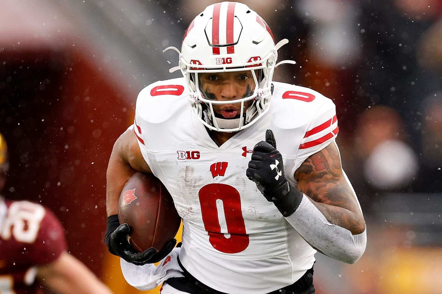 MINNEAPOLIS, MINNESOTA - NOVEMBER 25: Braelon Allen #0 of the Wisconsin Badgers runs with the ball against the Minnesota Golden Gophers in the first half at Huntington Bank Stadium on November 25, 2023 in Minneapolis, Minnesota. The Badgers defeated the Golden Gophers 28-14. (Photo by David Berding/Getty Images)