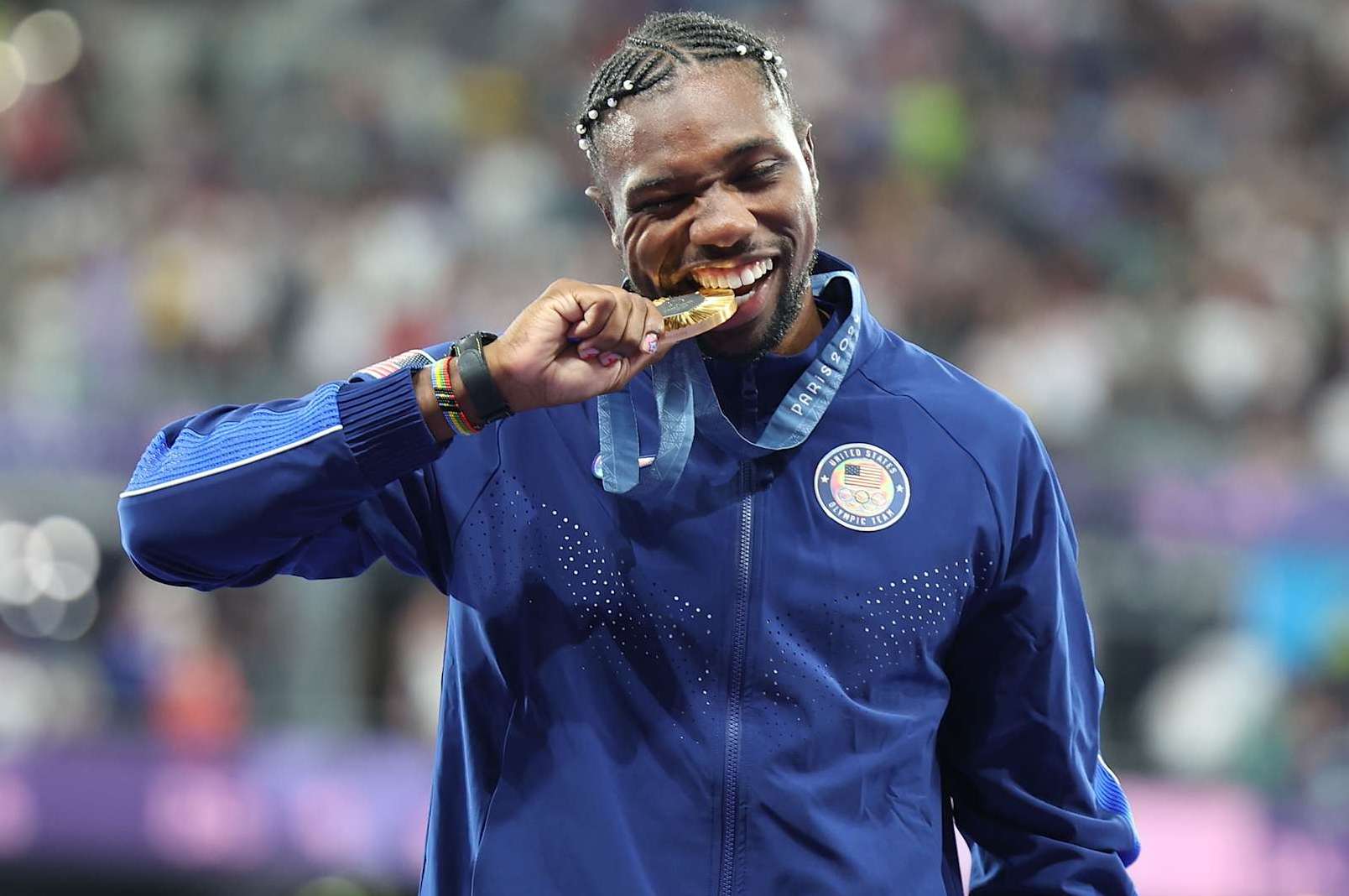 Gold medalist Noah Lyles of United States reacts during the victory ceremony of the men's 100m of Athletics at the Paris 2024 Olympic Games in Paris, France, Aug. 5, 2024. (Photo by Li Ying/Xinhua via Getty Images)