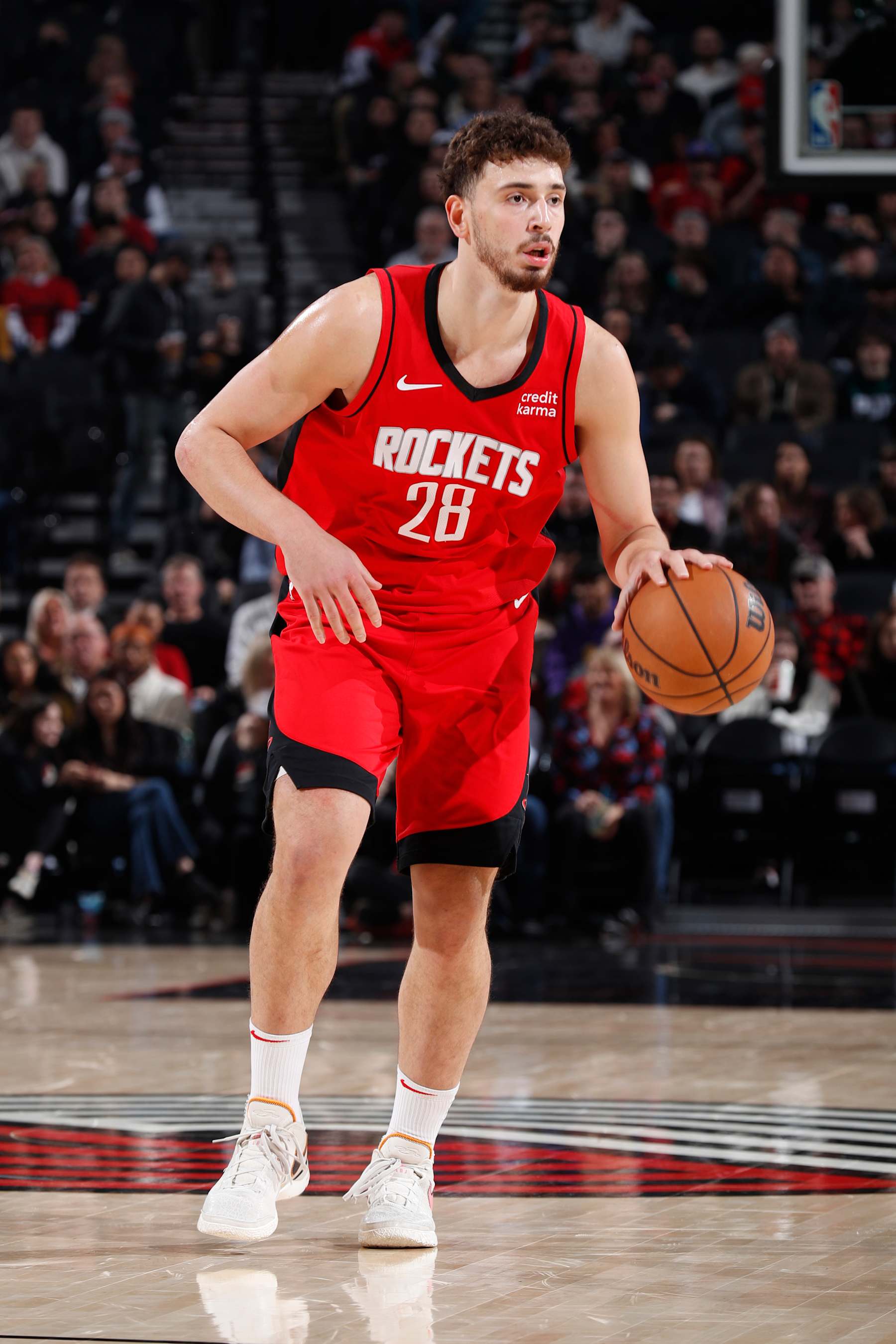 PORTLAND, OR - MARCH 8:  Alperen Sengun #28 of the Houston Rockets handles the ball during the game  on March 8, 2024 at the Moda Center Arena in Portland, Oregon. NOTE TO USER: User expressly acknowledges and agrees that, by downloading and or using this photograph, user is consenting to the terms and conditions of the Getty Images License Agreement. Mandatory Copyright Notice: Copyright 2024 NBAE (Photo by Cameron Browne/NBAE via Getty Images)