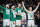 Boston, MA - February 14: The Boston Celtics bench, from left, Jayson Tatum, Derrick White, Luke Kornet and Sam Hauser cheer on their teammates in the second half. The Celtics beat the Brooklyn Nets, 136-86. (Photo by Erin Clark/The Boston Globe via Getty Images)